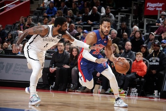 DETROIT, MI - JANUARY 25: Derrick Rose #25 of the Detroit Pistons handles the ball against Kyrie Irving #11 of the Brooklyn Nets on January 25, 2020 at Little Caesars Arena in Detroit, Michigan. NOTE TO USER: User expressly acknowledges and agrees that, b