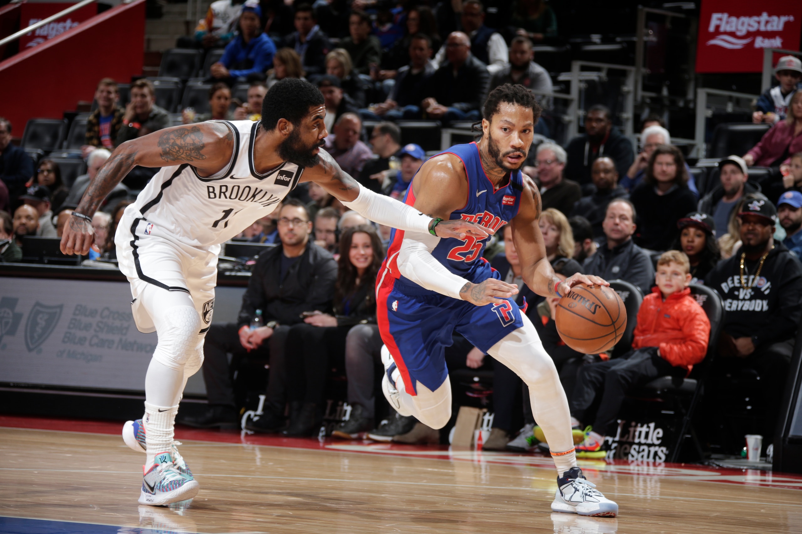 DETROIT, MI - JANUARY 25: Derrick Rose #25 of the Detroit Pistons handles the ball against Kyrie Irving #11 of the Brooklyn Nets on January 25, 2020 at Little Caesars Arena in Detroit, Michigan. NOTE TO USER: User expressly acknowledges and agrees that, b