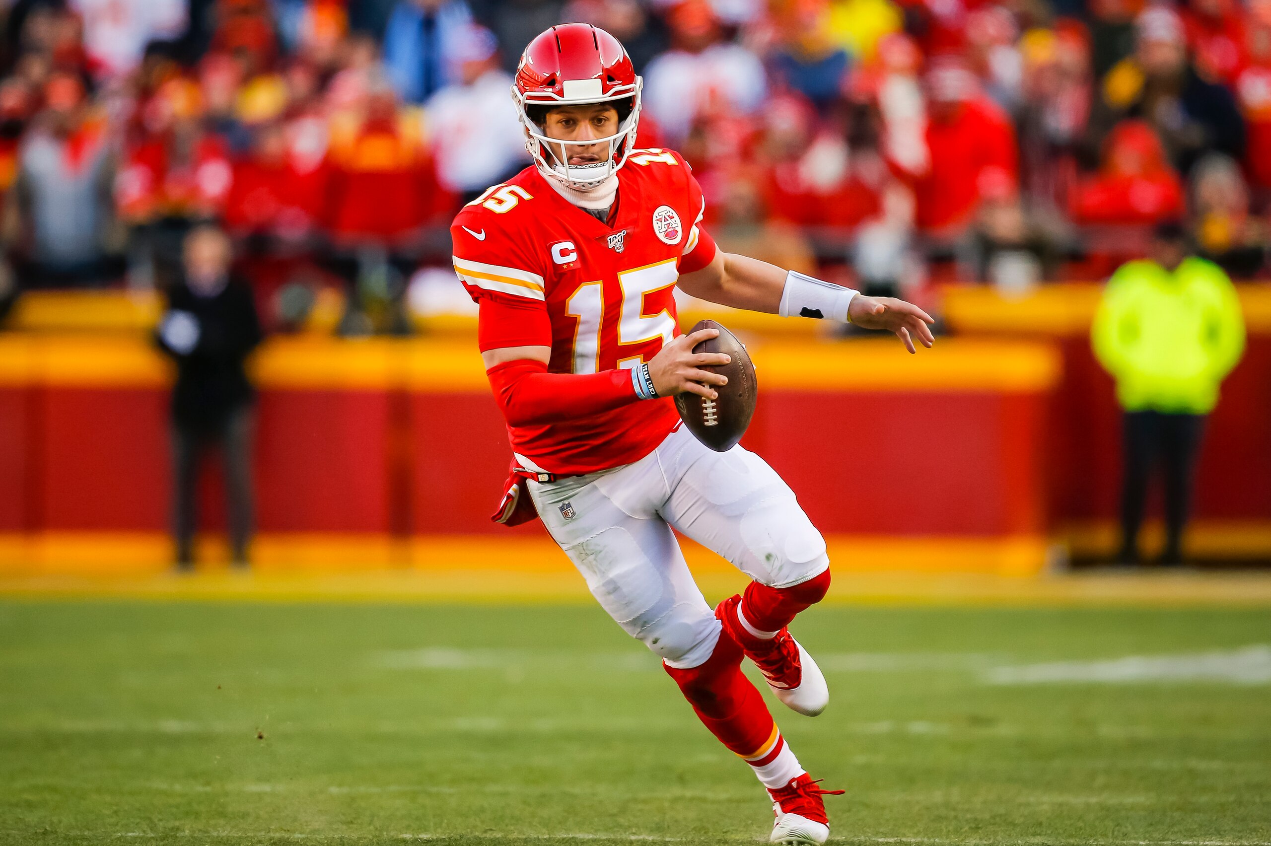 KANSAS CITY, MO - JANUARY 19: Patrick Mahomes #15 of the Kansas City Chiefs runs with the football in the second quarter of the AFC Championship game against the Tennessee Titans at Arrowhead Stadium on January 19, 2020 in Kansas City, Missouri. (Photo by
