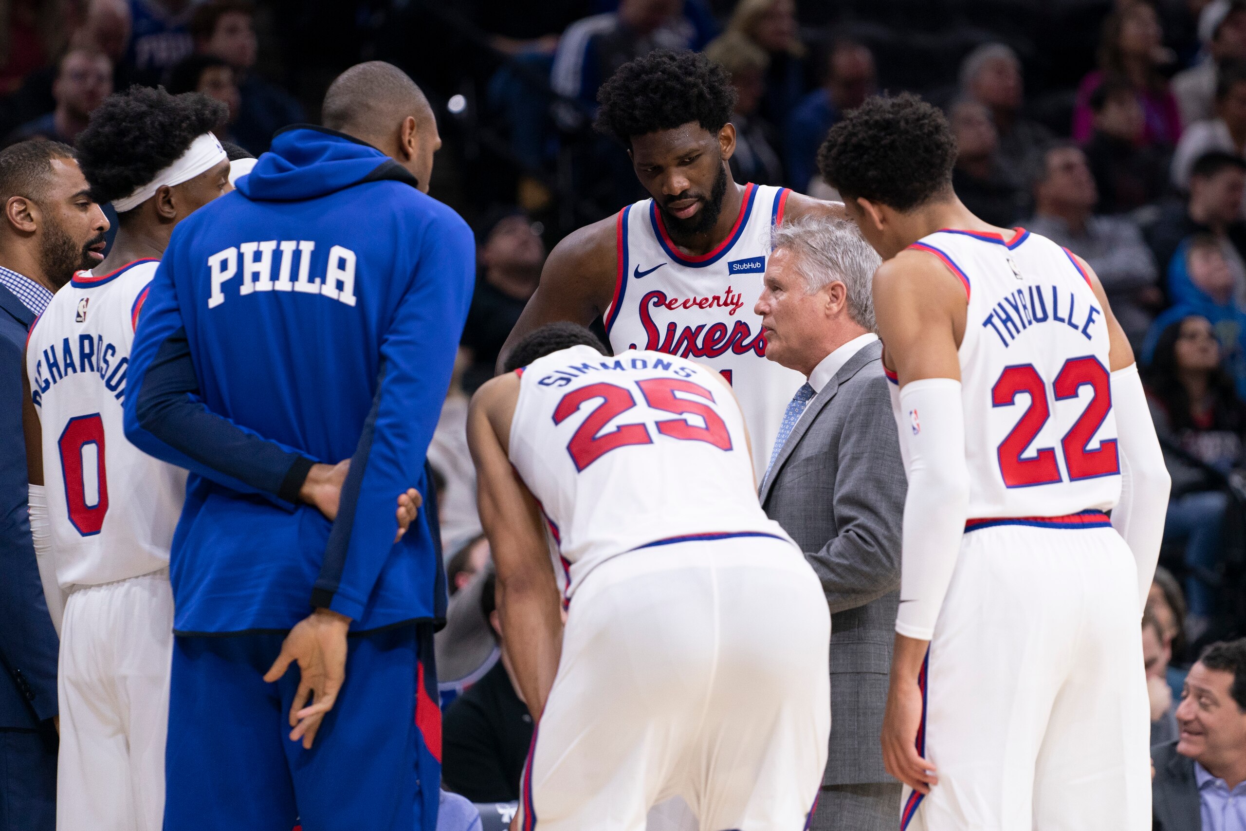 PHILADELPHIA, PA - DECEMBER 13: Josh Richardson #0, Al Horford #42, Ben Simmons #25, Joel Embiid #21, Matisse Thybulle #22, and head coach Brett Brown of the Philadelphia 76ers huddle against the New Orleans Pelicans at the Wells Fargo Center on December 