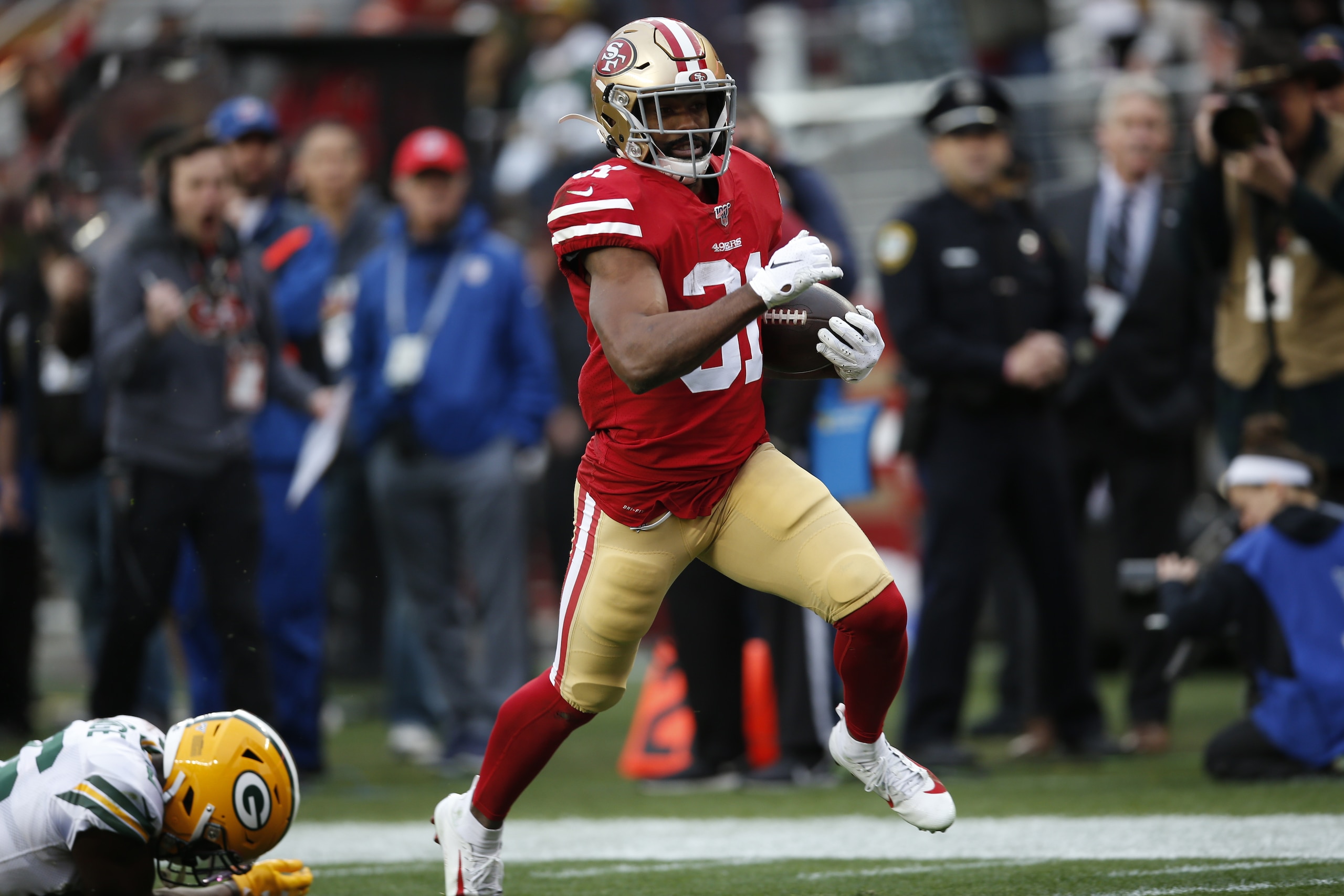 SANTA CLARA, CA - JANUARY 19: Raheem Mostert #31 of the San Francisco 49ers rushes for a 36-yard touchdown during the game against the Green Bay Packers at Levi's Stadium on January 19, 2020 in Santa Clara, California. The 49ers defeated the Packers 37-20