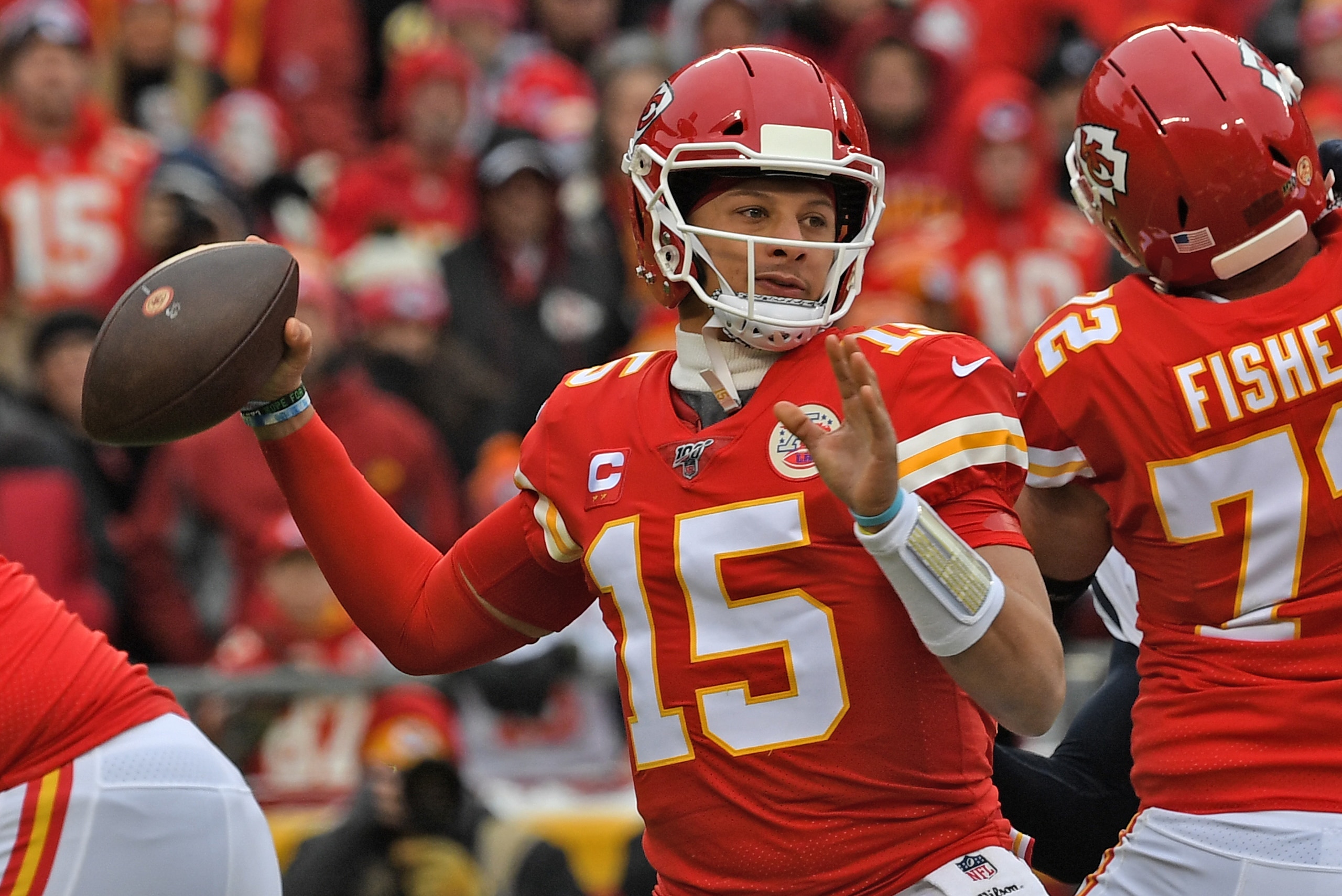 KANSAS CITY, MISSOURI - JANUARY 12: Quarterback Patrick Mahomes #15 of the Kansas City Chiefs throws a pass in the first half during the AFC Divisional playoff game against the Houston Texans at Arrowhead Stadium on January 12, 2020 in Kansas City, Missou