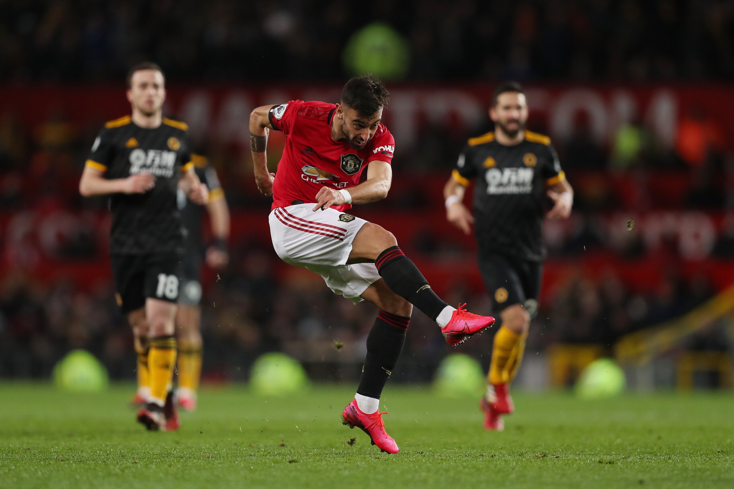 MANCHESTER, ENGLAND - FEBRUARY 01: Bruno Fernandes of Manchester United has a shot on goal during the Premier League match between Manchester United and Wolverhampton Wanderers at Old Trafford on February 1, 2020 in Manchester, United Kingdom. (Photo by M