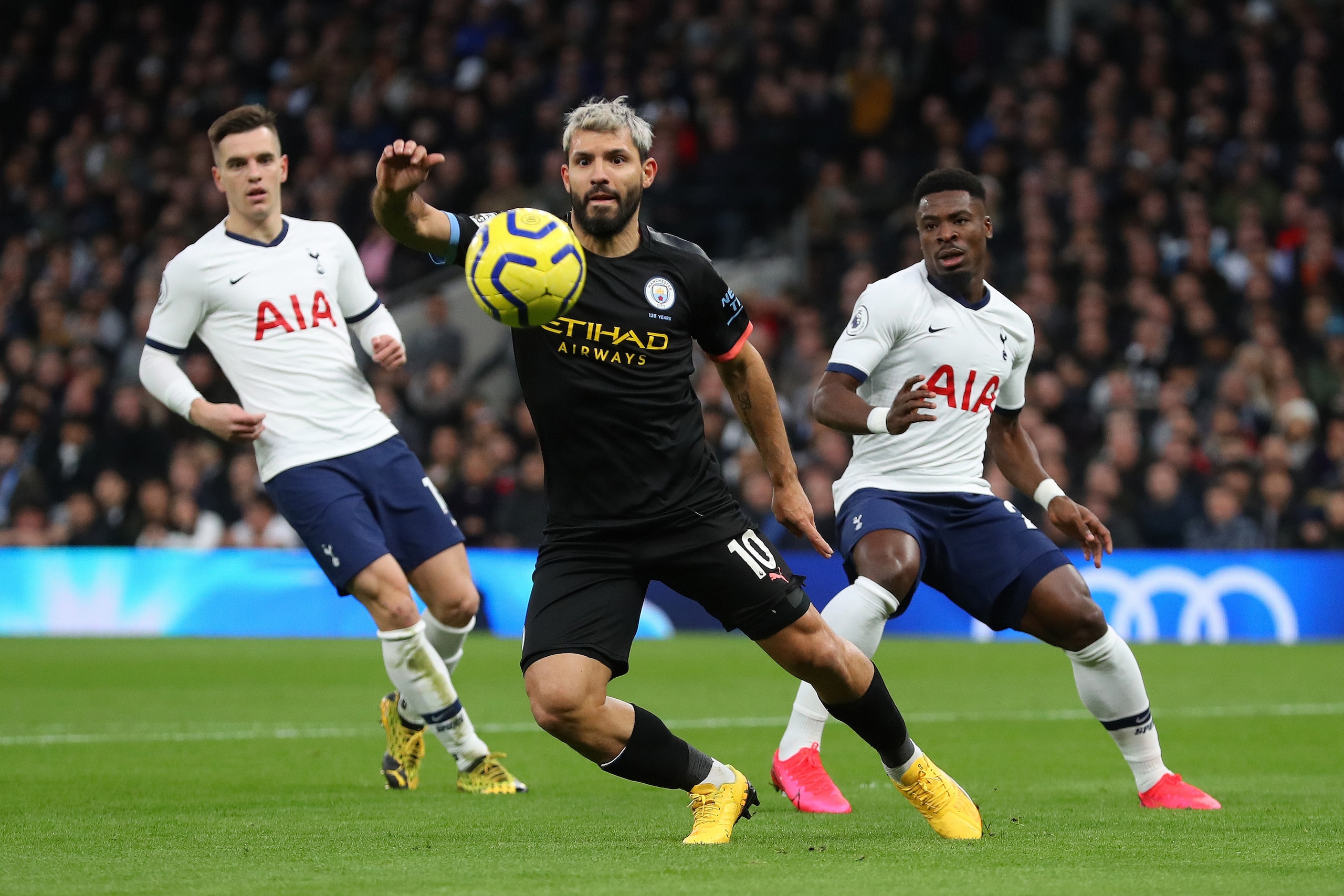 LONDON, ENGLAND - FEBRUARY 02: Sergio Aguero of Manchester City gets past Giovani Lo Celso and Serge Aurier of Tottenham Hotspur  during the Premier League match between Tottenham Hotspur and Manchester City at Tottenham Hotspur Stadium on February 02, 20