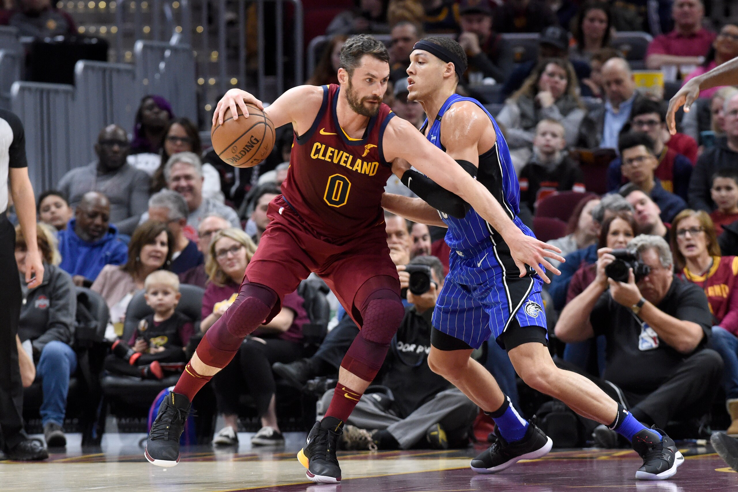CLEVELAND, OHIO - MARCH 03: Kevin Love #0 of the Cleveland Cavaliers posts up against Aaron Gordon #00 of the Orlando Magic during the first half at Quicken Loans Arena on March 03, 2019 in Cleveland, Ohio. NOTE TO USER: User expressly acknowledges and a CLEVELAND, OHIO - MARCH 03: Kevin Love #0 of the Cleveland Cavaliers posts up against Aaron Gordon #00 of the Orlando Magic during the first half at Quicken Loans Arena on March 03, 2019 in Cleveland, Ohio. NOTE TO USER: User expressly acknowledges and a