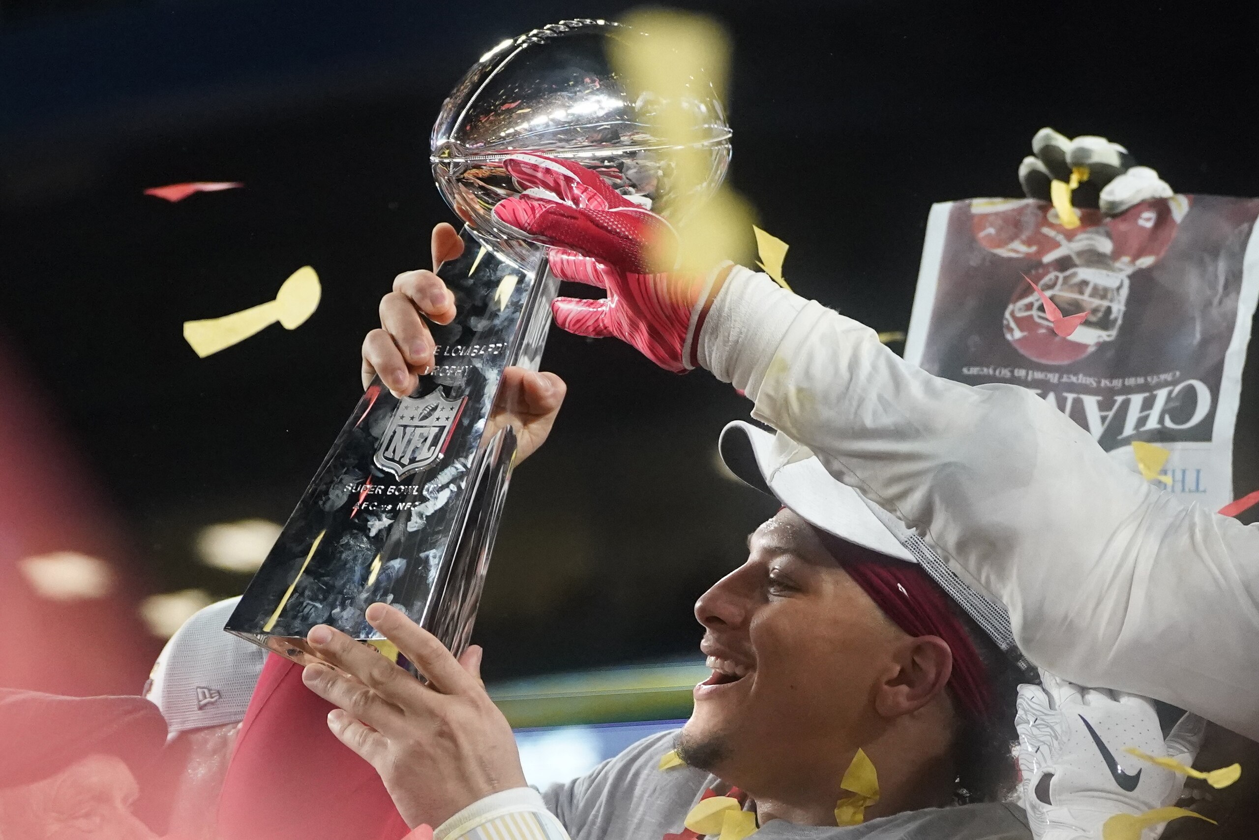 Quarterback for the Kansas City Chiefs Patrick Mahomes holds up the Vince Lombardi Trophy as he celebrates with teammates on the podium after winning Super Bowl LIV against the San Francisco 49ers at Hard Rock Stadium in Miami Gardens, Florida, on Februar Quarterback for the Kansas City Chiefs Patrick Mahomes holds up the Vince Lombardi Trophy as he celebrates with teammates on the podium after winning Super Bowl LIV against the San Francisco 49ers at Hard Rock Stadium in Miami Gardens, Florida, on Februar