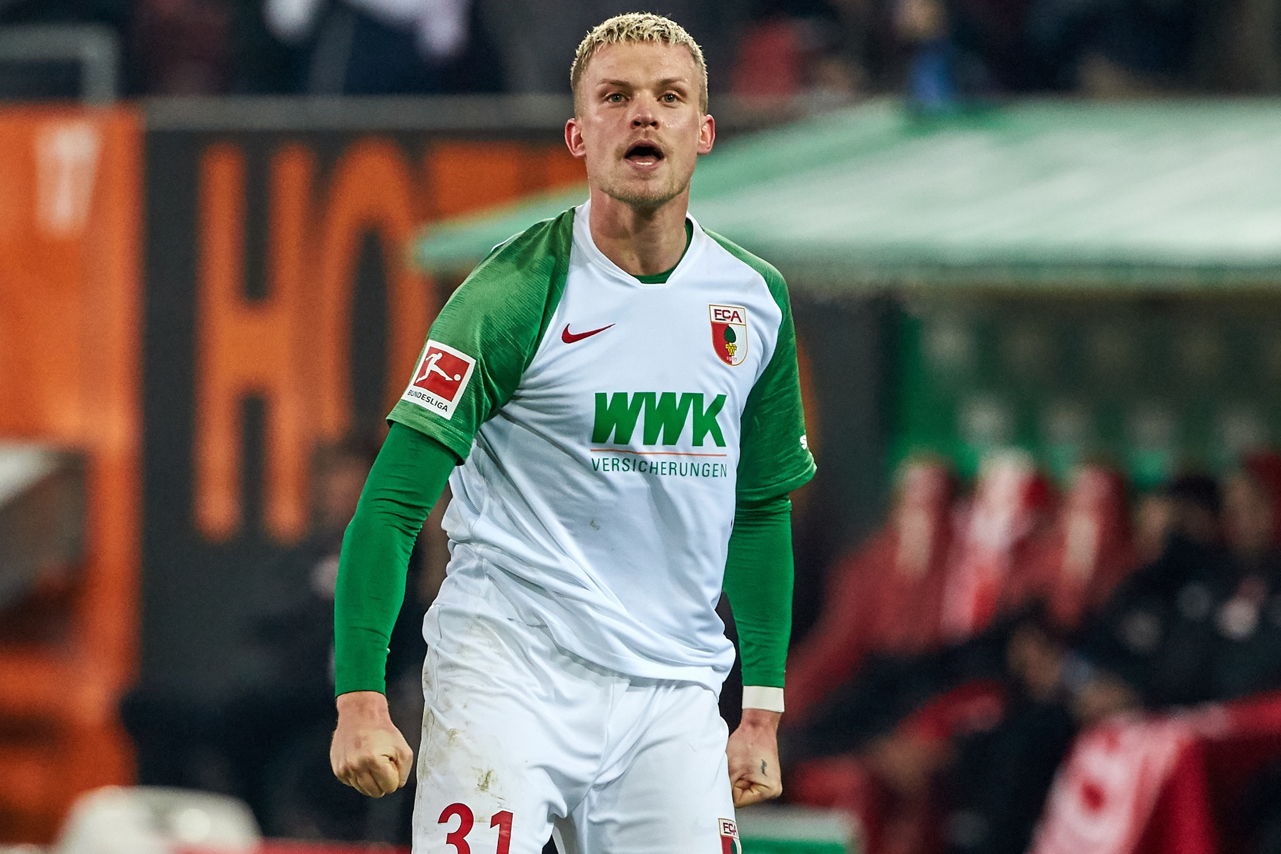 AUGSBURG, GERMANY - DECEMBER 17: (BILD ZEITUNG OUT) Philipp Max of Fc Augsburg celebrates his team's third goal during the Bundesliga match between FC Augsburg and Fortuna Duesseldorf at WWK-Arena on December 17, 2019 in Augsburg, Germany. (Photo by TF-Im