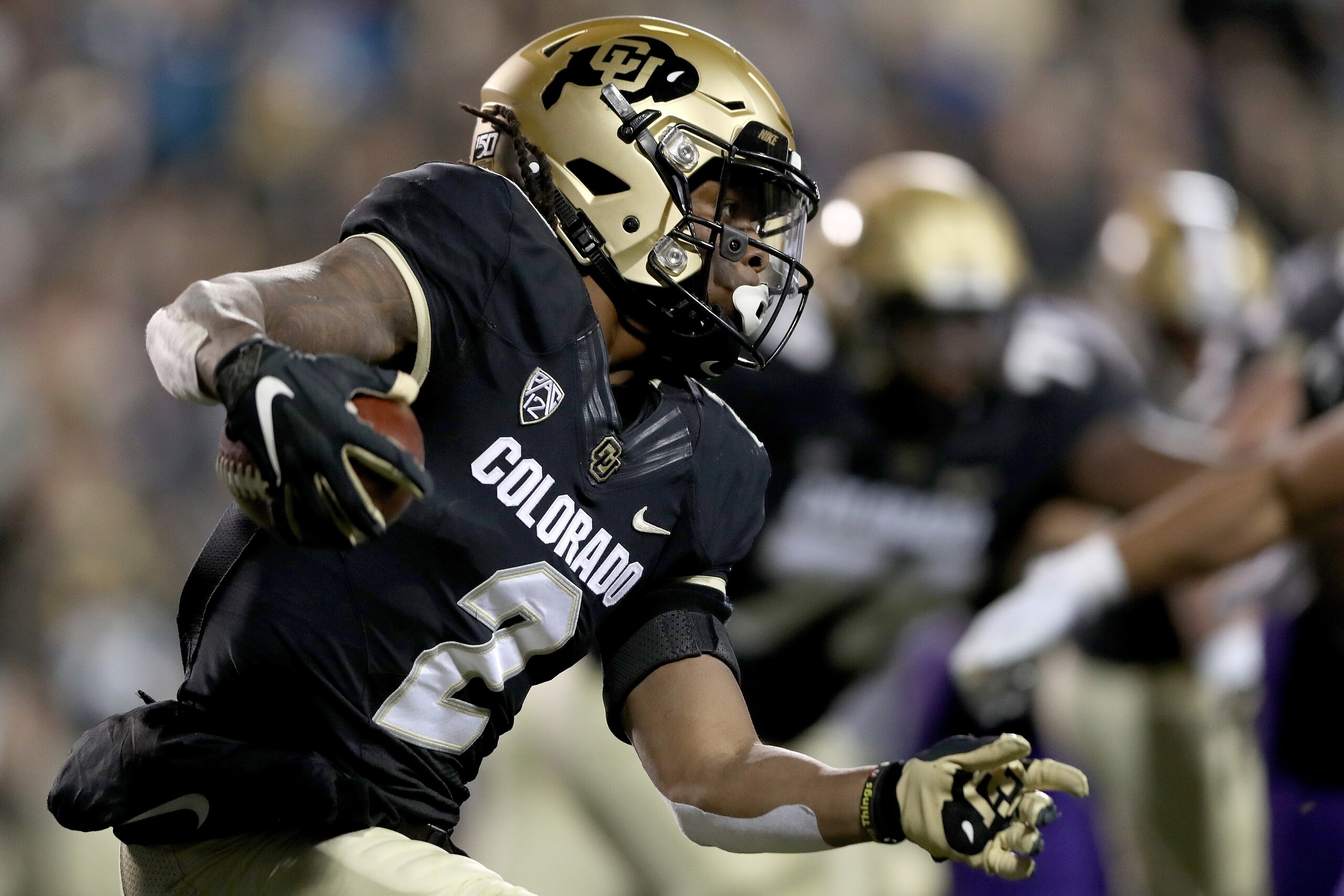 BOULDER, COLORADO - NOVEMBER 23: Laviska Shenault Jr. #2 of the Colorado Buffaloes carries the ball against the Washington Huskies in the first quarter at Folsom Field on November 23, 2019 in Boulder, Colorado. (Photo by Matthew Stockman/Getty Images)