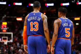 MIAMI, FLORIDA - DECEMBER 20:  Marcus Morris Sr. #13 and Dennis Smith Jr. #5 of the New York Knicks talk against the Miami Heat during the second half at American Airlines Arena on December 20, 2019 in Miami, Florida. NOTE TO USER: User expressly acknowle