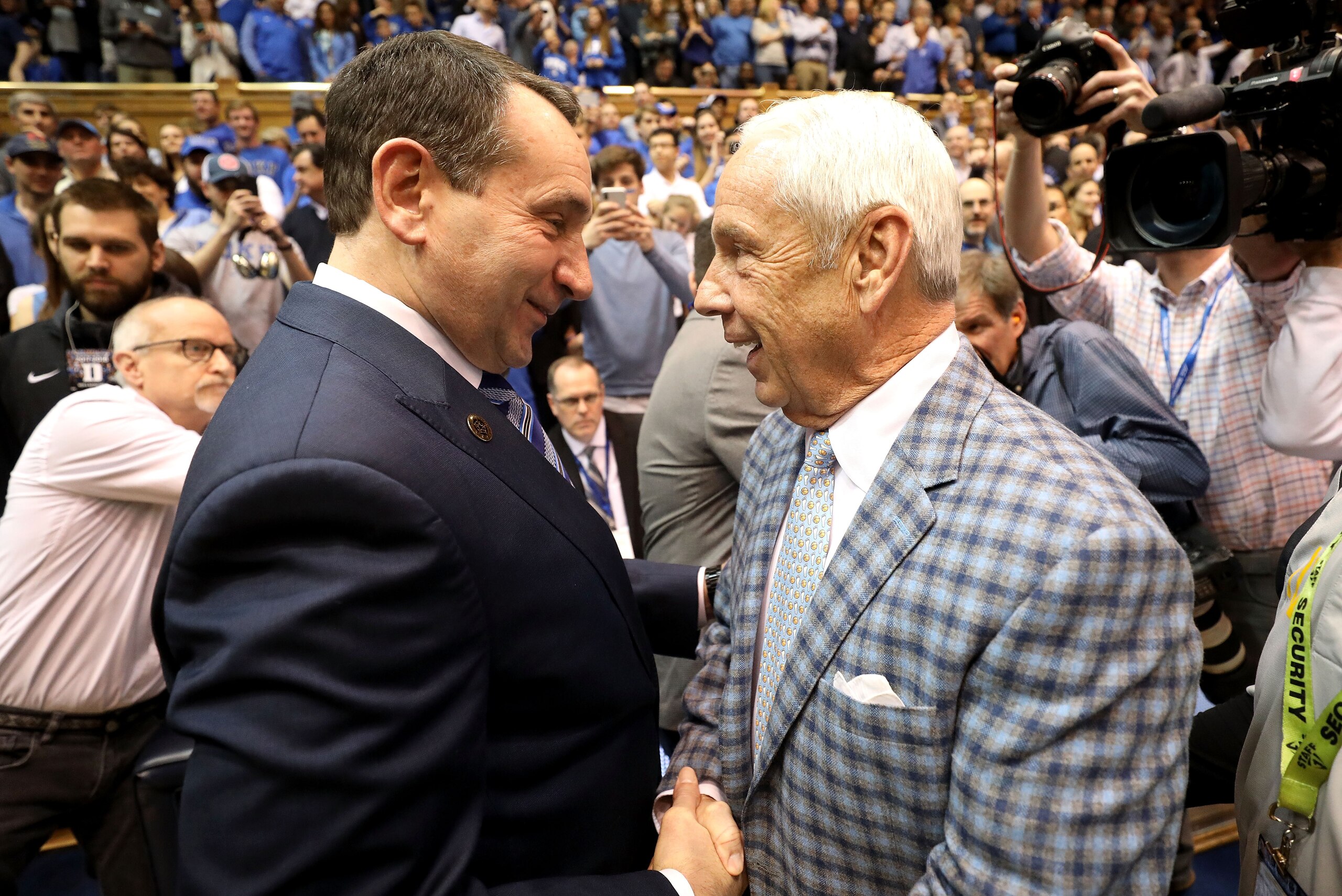 DURHAM, NC - MARCH 03:  (L-R) Head coach Mike Krzyzewski of the Duke Blue Devils talks to head coach Roy Williams of the North Carolina Tar Heels before their game at Cameron Indoor Stadium on March 3, 2018 in Durham, North Carolina.  (Photo by Streeter L