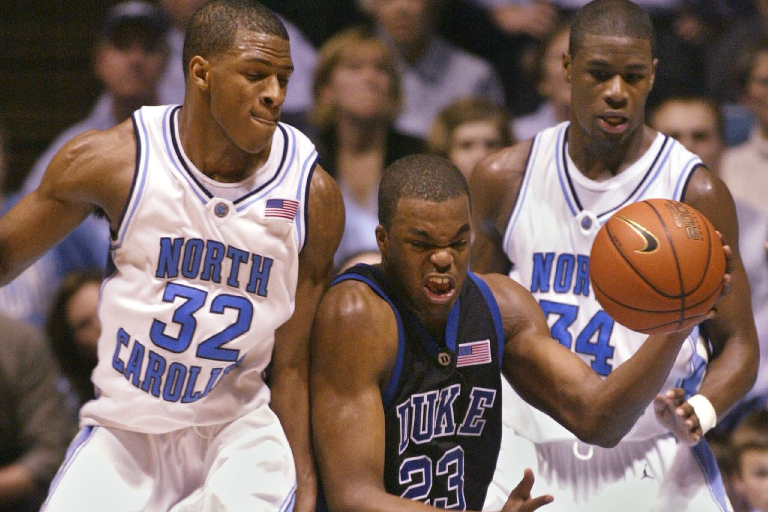 Rashad McCants (32), Shelden Williams (23) and David Noel (34) during a 2003 Duke-UNC game.