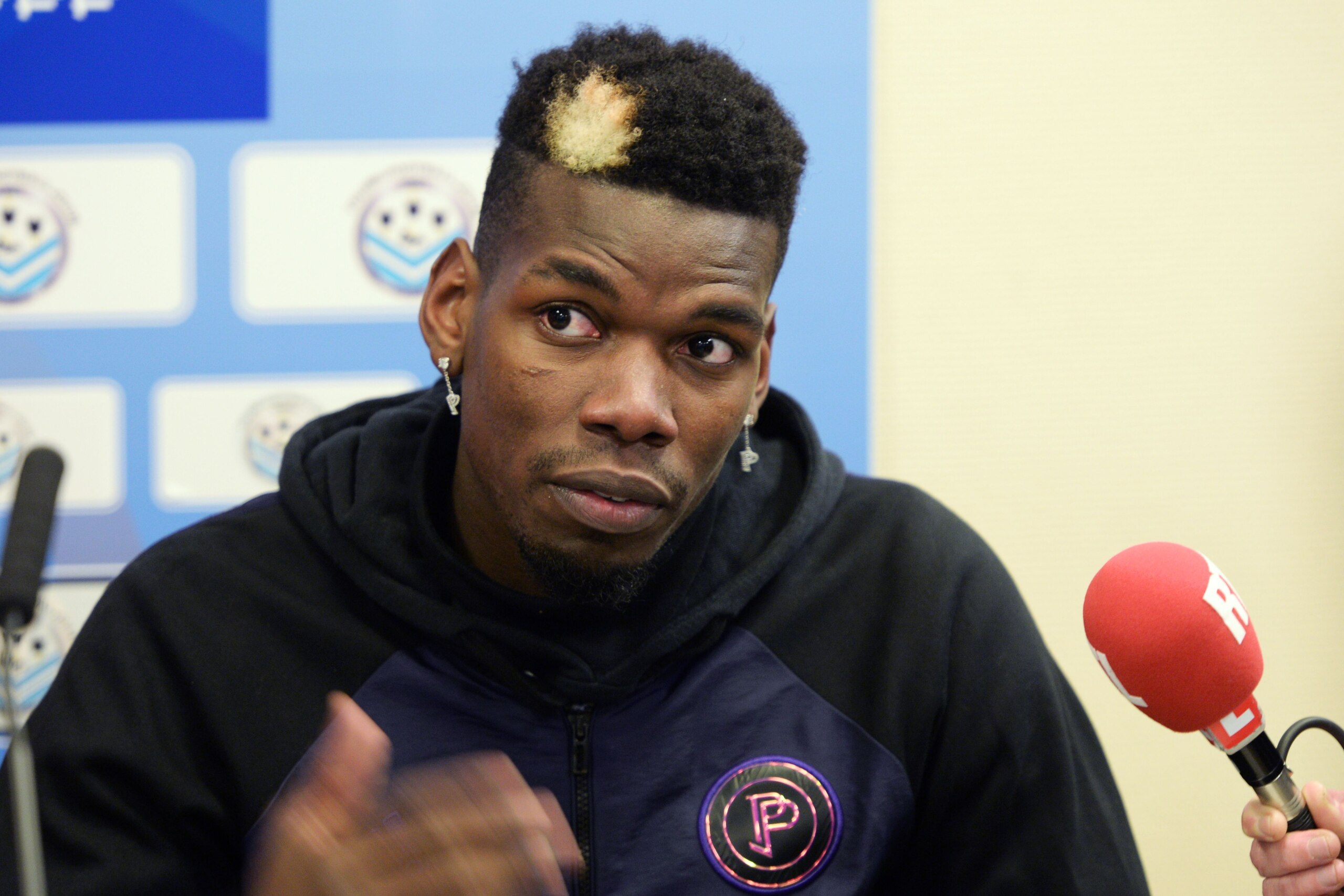 Manchester United and France midfielder Paul Pogba gives a press conference after a  gala football match between All Star France and Guinea at the Vallee du Cher Stadium in Tours, central France, on December 29, 2019, as part of the