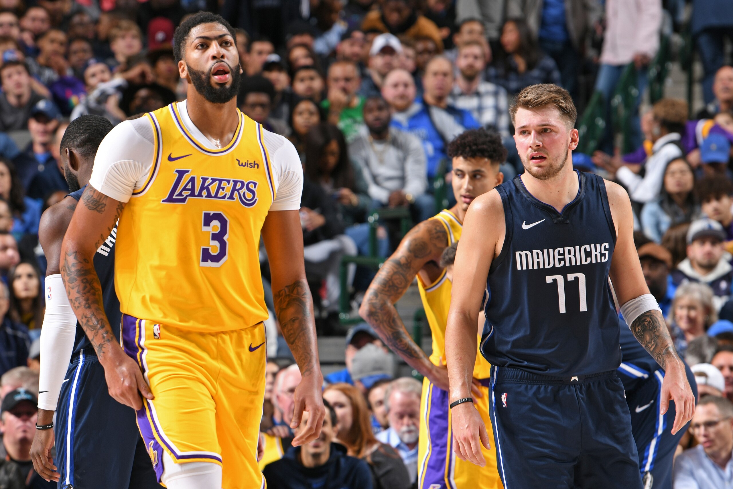 DALLAS, TX - NOVEMBER 1: Anthony Davis #3 of the Los Angeles Lakers and Luka Doncic #77 of the Dallas Mavericks walk up court on November 1, 2019 at the American Airlines Center in Dallas, Texas. NOTE TO USER: User expressly acknowledges and agrees that, 