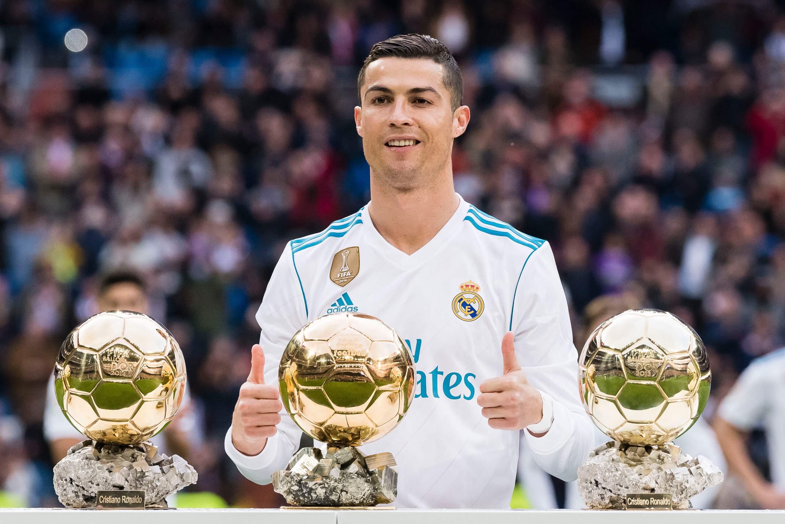 MADRID, SPAIN - DECEMBER 09: Cristiano Ronaldo of Real Madrid poses for photos with his FIFA Ballon Dor Trophies prior to the La Liga 2017-18 match between Real Madrid and Sevilla FC at Santiago Bernabeu Stadium on 09 December 2017 in Madrid, Spain. (Phot