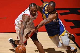 TORONTO, CANADA - JUNE 10: Andre Iguodala #9 of the Golden State Warriors goes for a steal against Kawhi Leonard #2 of the Toronto Raptors during Game Five of the NBA Finals on June 10, 2019 at Scotiabank Arena in Toronto, Ontario, Canada. NOTE TO USER: U