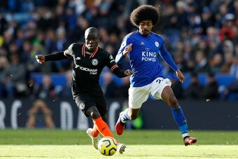 Chelsea's French midfielder N'Golo Kante (L) vies with Leicester City's English midfielder Hamza Choudhury during the English Premier League football match between Leicester City and Chelsea at King Power Stadium in Leicester, central England on February 