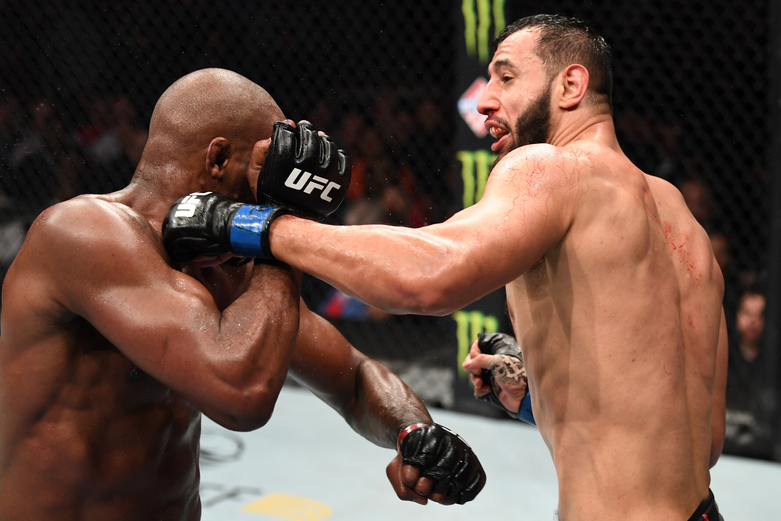 HOUSTON, TEXAS - FEBRUARY 08: (R-L) Dominick Reyes punches Jon Jones in their light heavyweight championship bout during the UFC 247 event at Toyota Center on February 08, 2020 in Houston, Texas. (Photo by Josh Hedges/Zuffa LLC via Getty Images) HOUSTON, TEXAS - FEBRUARY 08: (R-L) Dominick Reyes punches Jon Jones in their light heavyweight championship bout during the UFC 247 event at Toyota Center on February 08, 2020 in Houston, Texas. (Photo by Josh Hedges/Zuffa LLC via Getty Images)
