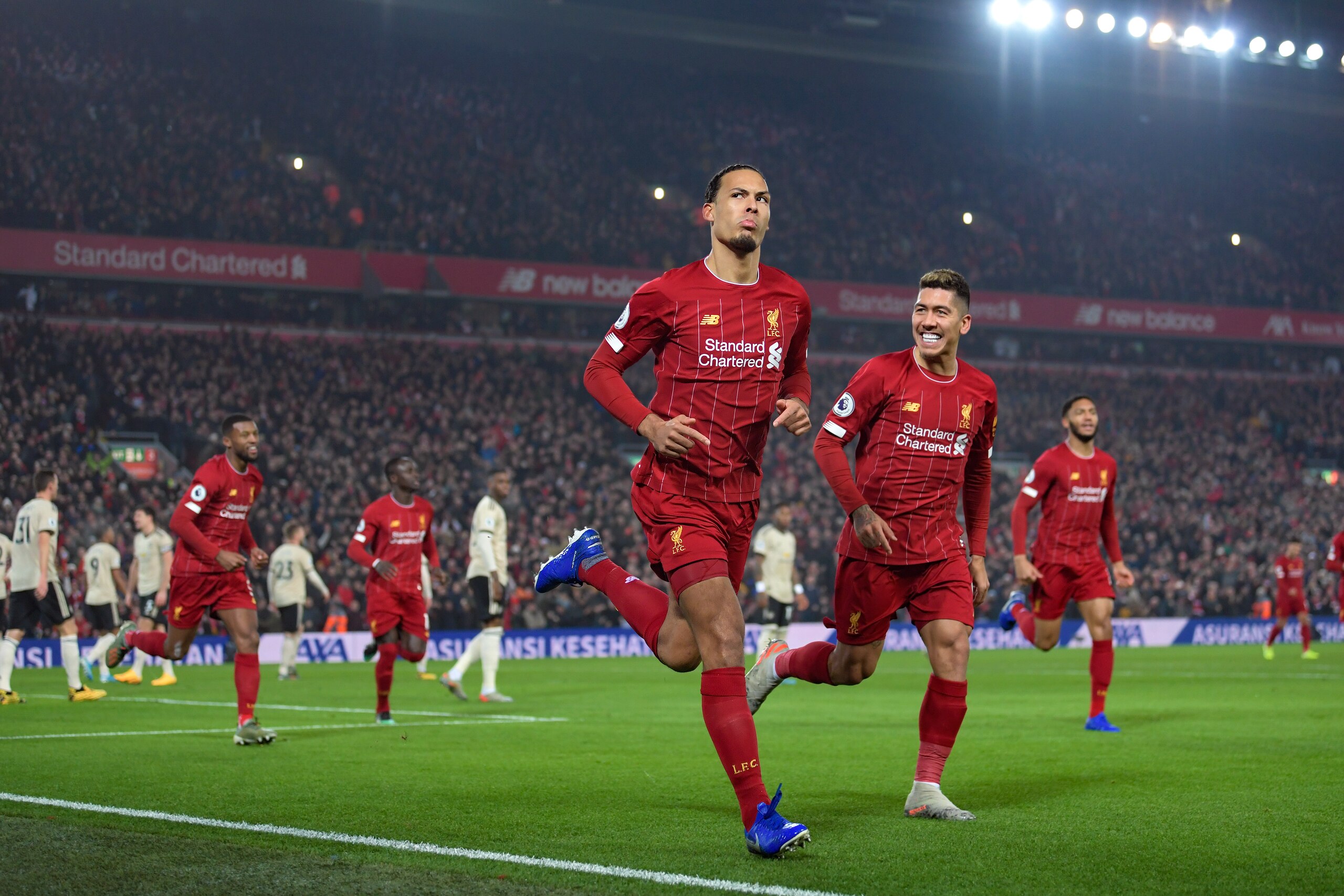 LIVERPOOL, ENGLAND - JANUARY 19: Virgil van Dijk of Liverpool celebrates scoring to make it 1-0 during the Premier League match between Liverpool FC and Manchester United at Anfield on January 19, 2020 in Liverpool, United Kingdom. (Photo by Michael Regan
