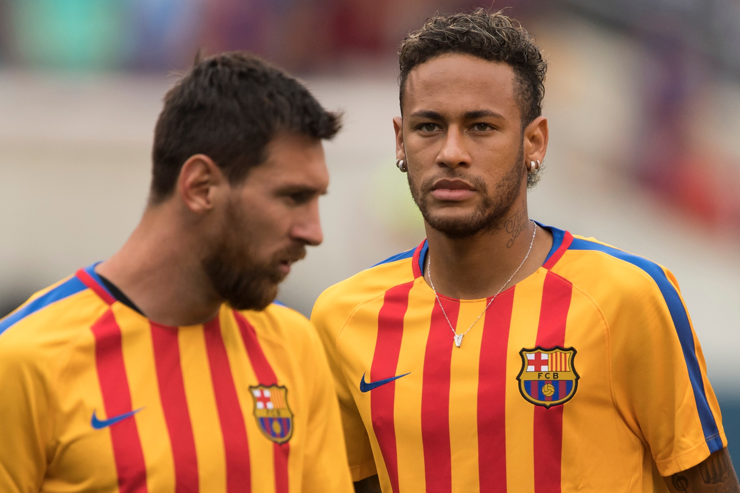 (FILES) This file photo taken on July 22, 2017 shows Neymar (R) and Lionel Messi (L) of FC Barcelona warming up before the International Champions Cup (ICC)  match between Juventus FC and FC Barcelona at the Met Life Stadium in East Rutherford, New Jersey