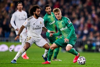 MADRID, SPAIN - FEBRUARY 06: Marcelo Vieira of Real Madrid battle for the ball Martin Odegaard of Real Sociedad  during the Spanish King Cup match between Real Madrid and Real Sociedad on February 06, 2020 in Madrid, Spain. (Photo by Quality Sport Images/