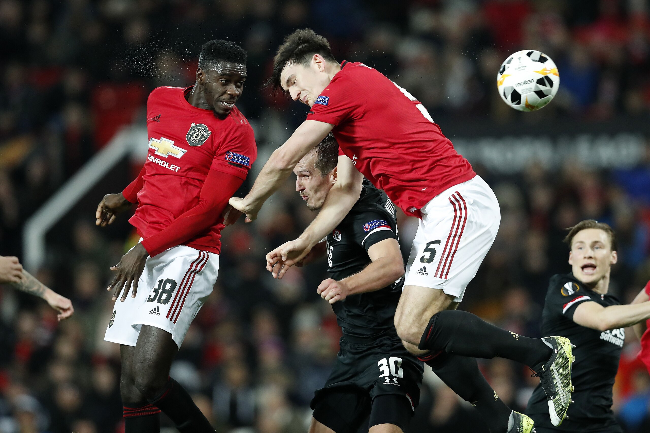 (L-R) Axel Tuanzebe of Manchester United, Stijn Wuytens of AZ Alkmaar, Harry Maguire of Manchester United during the UEFA Europa League group L match between Manchester United and AZ Alkmaar at at Old Trafford on December 12, 2019 in Manchester, United Ki