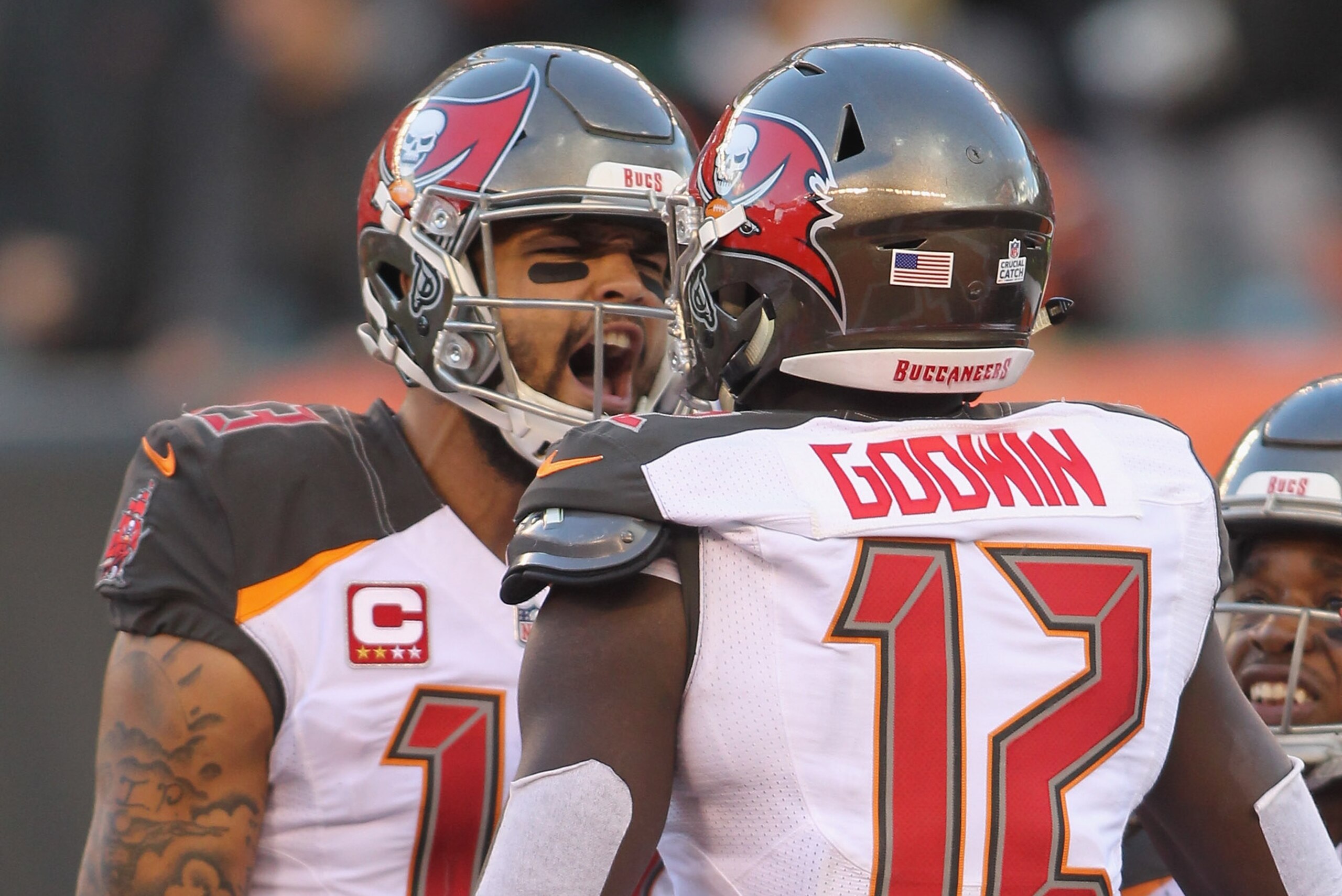 CINCINNATI, OH - OCTOBER 28:  Mike Evans #13 and Chris Godwin #12 of the Tampa Bay Bucccaneers celebrate a touchdown during their game against the Cincinnati Bengals at Paul Brown Stadium on October 28, 2018 in Cincinnati, Ohio. The Bengals defeated the B