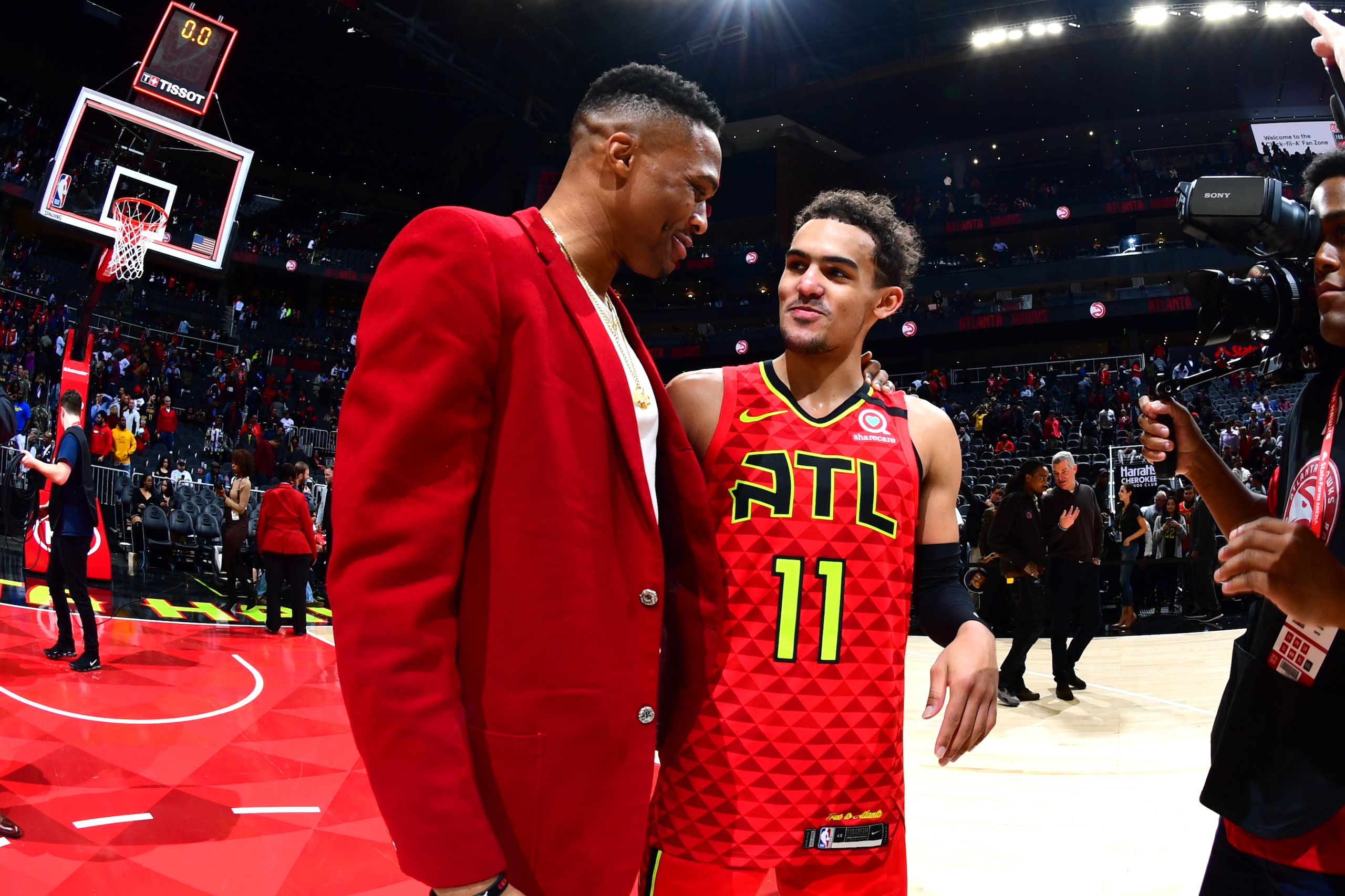 ATLANTA, GA - JANUARY 8: Russell Westbrook #0 of the Houston Rockets and Trae Young #11 of the Atlanta Hawks tall after the game on January 8, 2020 at State Farm Arena in Atlanta, Georgia.  NOTE TO USER: User expressly acknowledges and agrees that, by dow