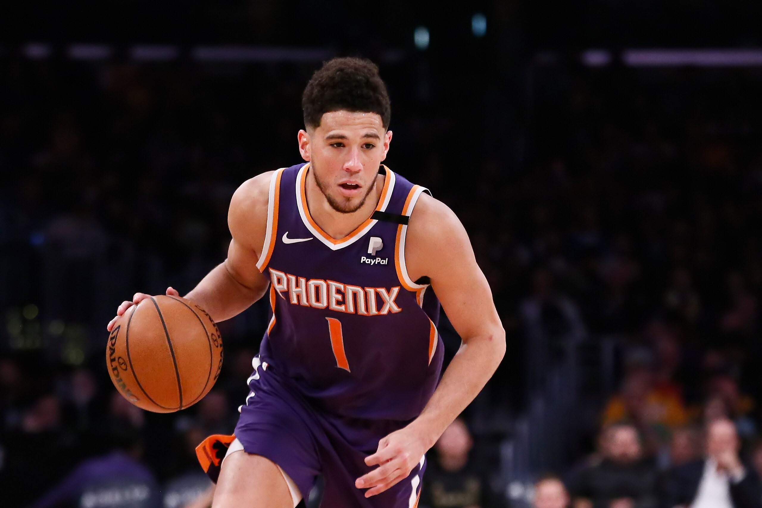 LOS ANGELES, CA - FEBRUARY 10: Devin Booker #1 of the Phoenix Suns drives to the basket against the Los Angeles Lakers at the Staples Center on February 10, 2020 in Los Angeles, CA. NOTE TO USER: User expressly acknowledges and agrees that, by downloading