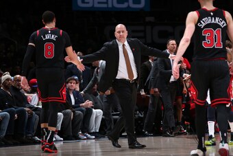 WASHINGTON, DC -¬ FEBRUARY 11: Zach LaVine #8 of the Chicago Bulls high-fives Jim Boylen of the Chicago Bulls during the game against the Washington Wizards on February 11, 2020 at Capital One Arena in Washington, DC. NOTE TO USER: User expressly acknowle