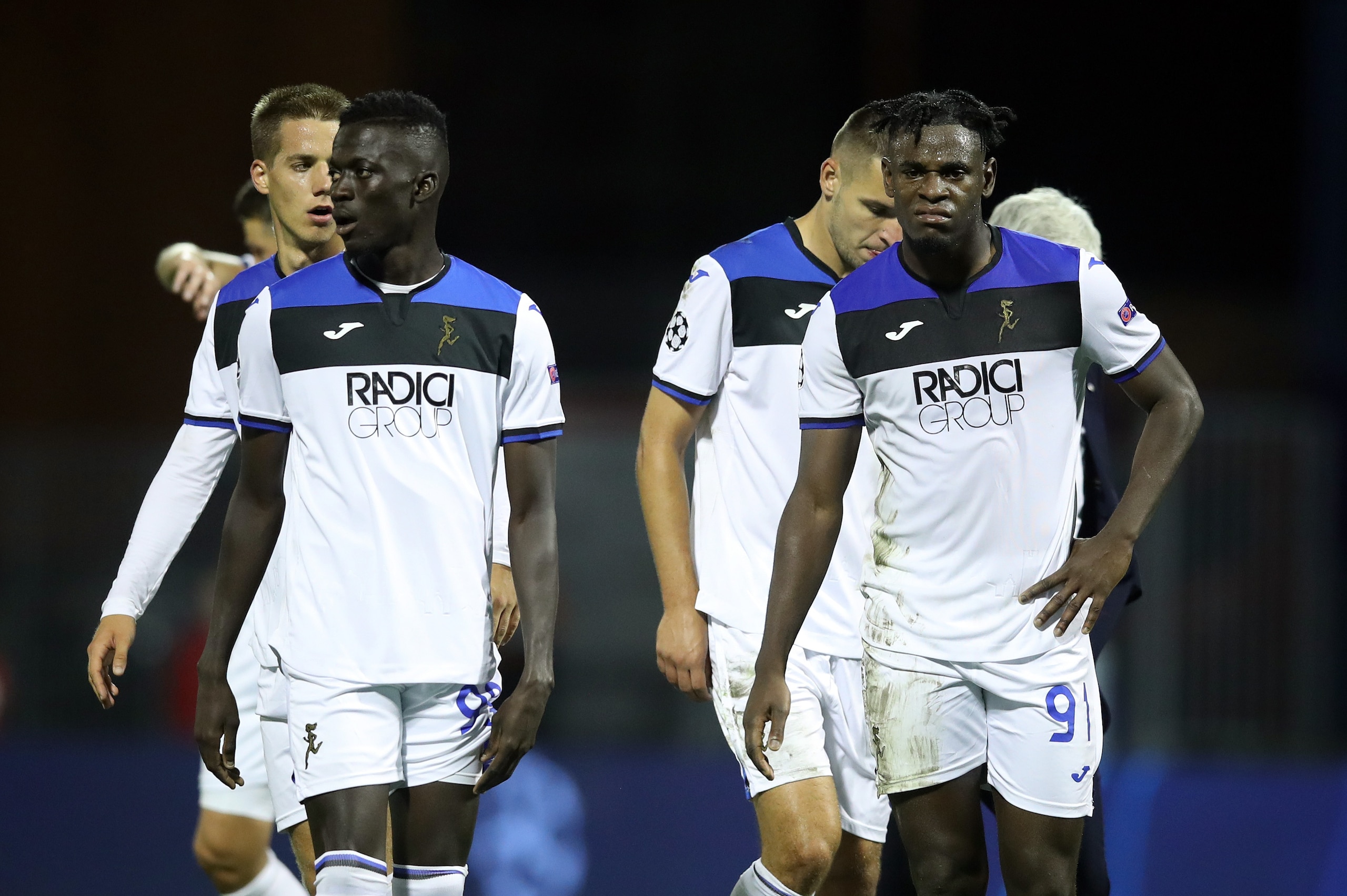 Atalanta's Colombian forward Zapata Duval (R) and Gambian forward Musa Barrow (L) react at the end of the UEFA Champions League Group C football match GNK Dinamo vs Atalanta BC in Zagreb, Croatia, on September 18, 2019. - Dinamo won the match 4-0. (Photo 