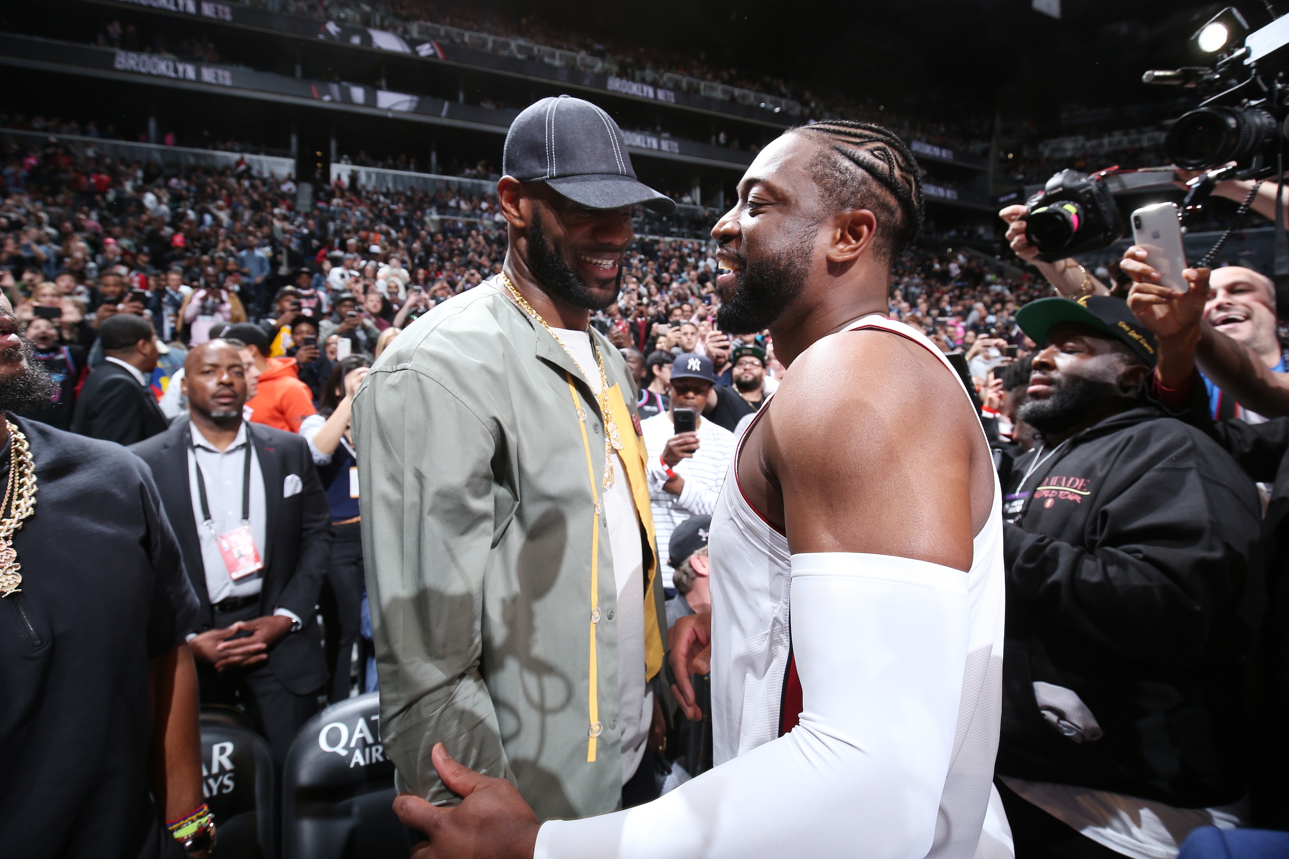BROOKLYN, NY - APRIL 10:  LeBron James #23 of the Los Angeles Lakers and Dwyane Wade #3 of the Miami Heat hug prior to the game against the Brooklyn Nets on April 10, 2019 at Barclays Center in Brooklyn, New York. NOTE TO USER: User expressly acknowledges