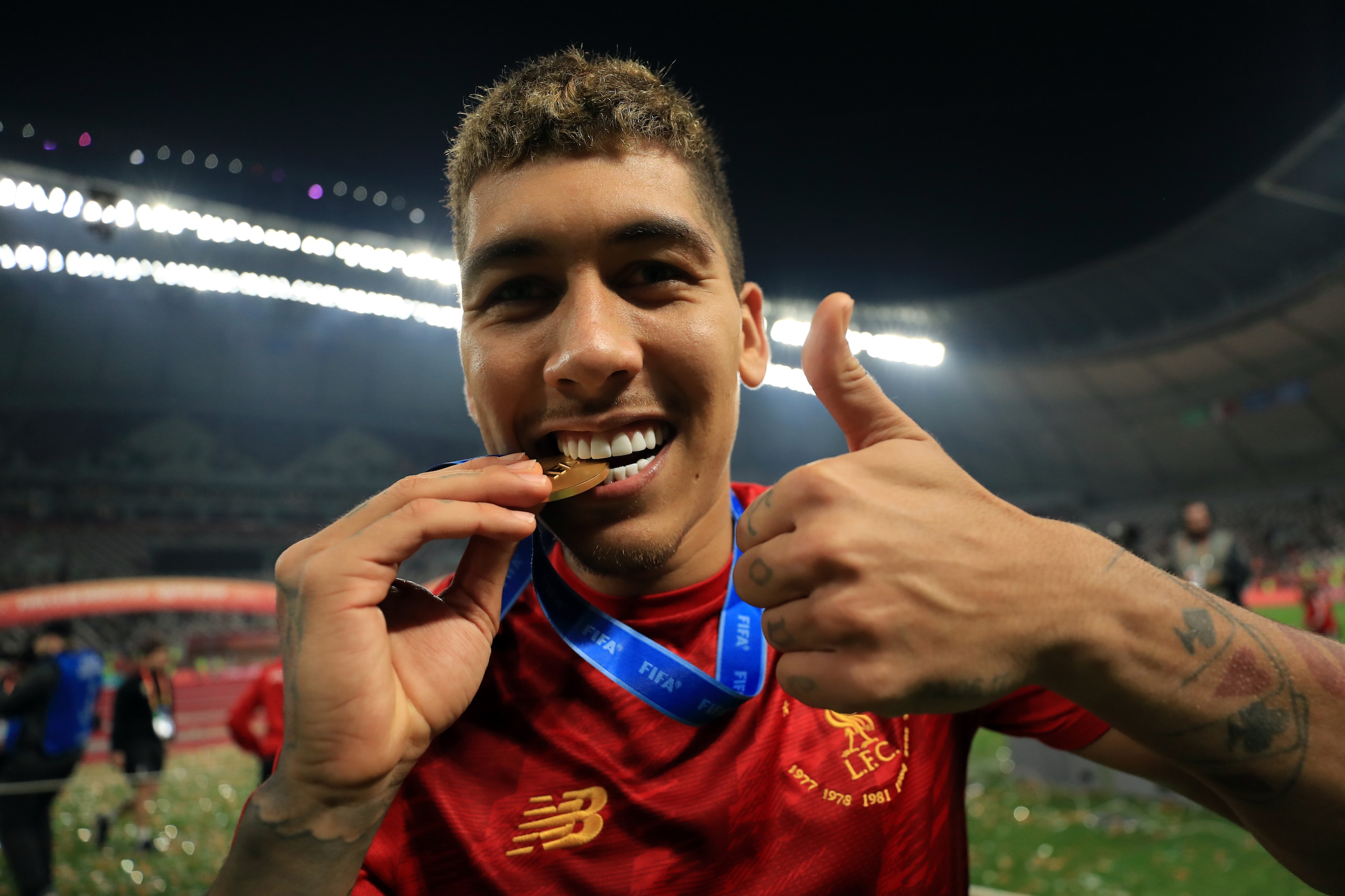 DOHA, QATAR - DECEMBER 21: Roberto Firmino of Liverpool pose with the FIFA Club World Cup Medal following their victory inthe FIFA Club World Cup final match between CR Flamengo and Liverpool FC at Khalifa International Stadium on December 21, 2019 in Doh