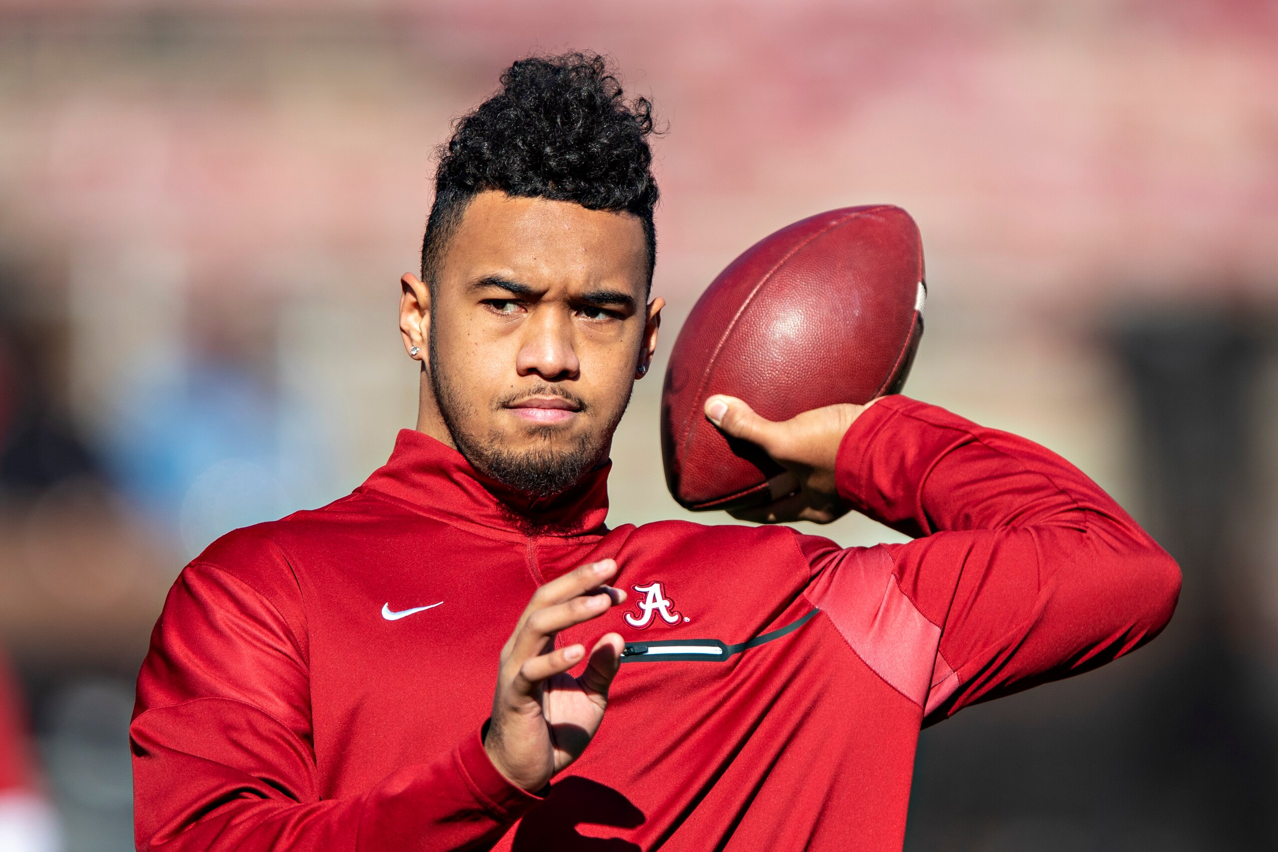 FAYETTEVILLE, AR - NOVEMBER 9: Tua Tagovailoa #13 of the Alabama Crimson Tide warms up before a game against the Mississippi State Bulldogs at Davis Wade Stadium on November 16, 2019 in Starkville, Mississippi. The Crimson Tide defeated the Bulldogs 38 FAYETTEVILLE, AR - NOVEMBER 9: Tua Tagovailoa #13 of the Alabama Crimson Tide warms up before a game against the Mississippi State Bulldogs at Davis Wade Stadium on November 16, 2019 in Starkville, Mississippi. The Crimson Tide defeated the Bulldogs 38