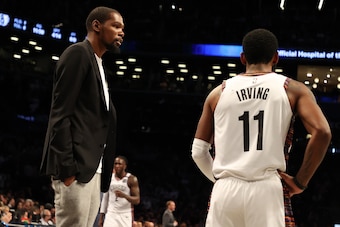NEW YORK, NEW YORK - JANUARY 18:  Kevin Durant #7 of the Brooklyn Nets talks to Kyrie Irving #11 of the Brooklyn Nets during their game against the Milwaukee Bucksat Barclays Center on January 18, 2020 in New York City.   NOTE TO USER: User expressly ackn