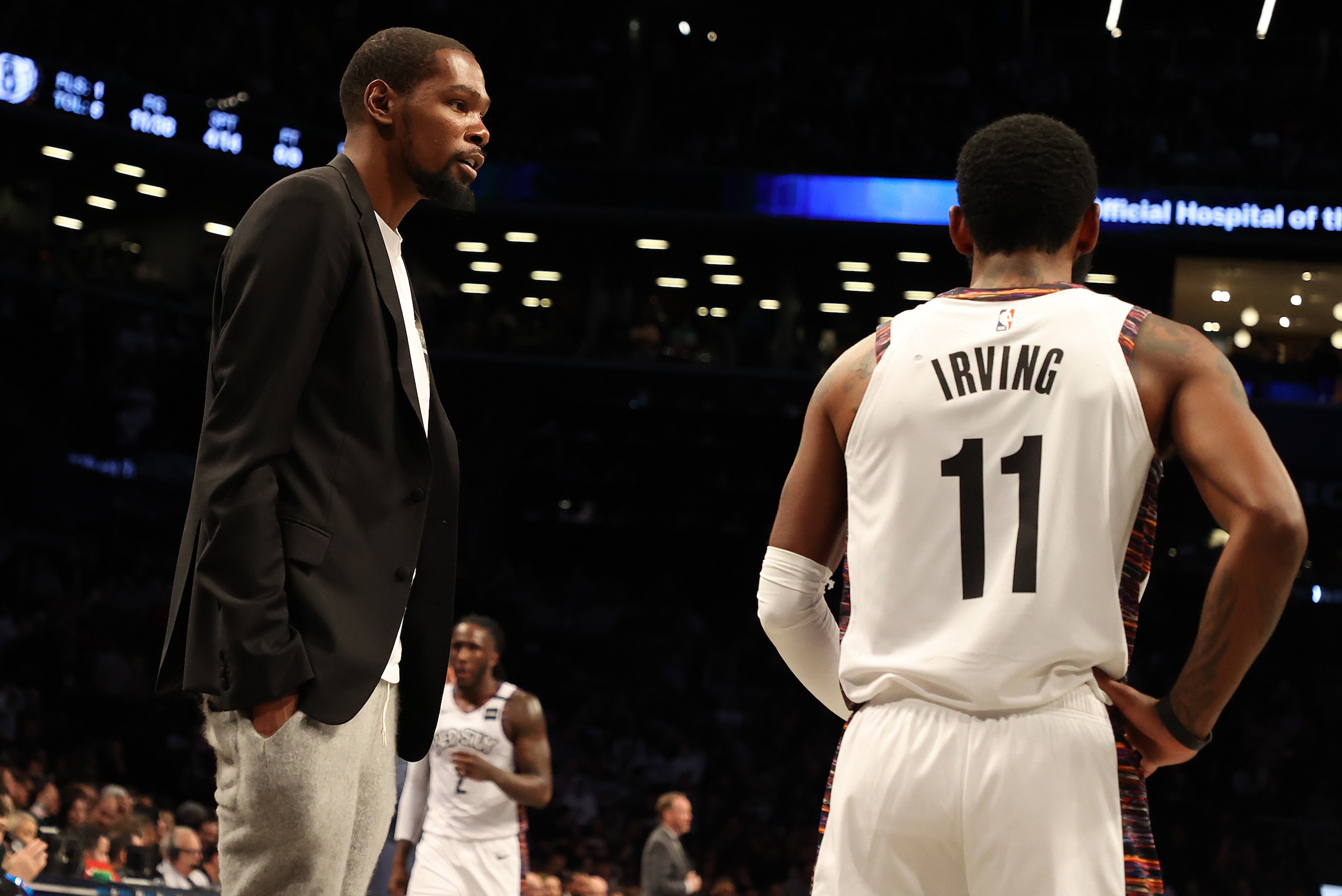 NEW YORK, NEW YORK - JANUARY 18:  Kevin Durant #7 of the Brooklyn Nets talks to Kyrie Irving #11 of the Brooklyn Nets during their game against the Milwaukee Bucksat Barclays Center on January 18, 2020 in New York City.   NOTE TO USER: User expressly ackn