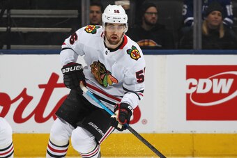 TORONTO, ON - JANUARY 18:  Erik Gustafsson #56 of the Chicago Blackhawks skates with the puck against the Toronto Maple Leafs during an NHL game at Scotiabank Arena on January 18, 2020 in Toronto, Ontario, Canada. The Blackhawks defeated the Maple Leafs 6