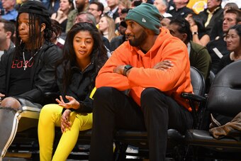 LOS ANGELES, CA - DECEMBER 29: Kobe Bryant and Gianna Bryant attend the game between the Los Angeles Lakers and the Dallas Mavericks on December 29, 2019 at STAPLES Center in Los Angeles, California. NOTE TO USER: User expressly acknowledges and agrees th