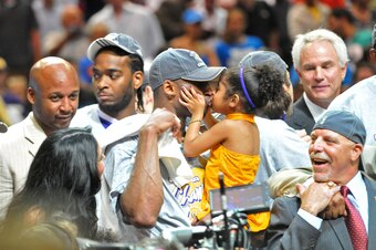 ORLANDO, FL - JUNE 14: Kobe Bryant #24 of the Los Angeles Lakers kisses his daughter Gianna Bryant as they celebrate the Lakers winning the 2009 NBA Finals against the Orlando Magic in Game Five of the 2009 NBA Finals at Amway Arena on June 14, 2009 in Or