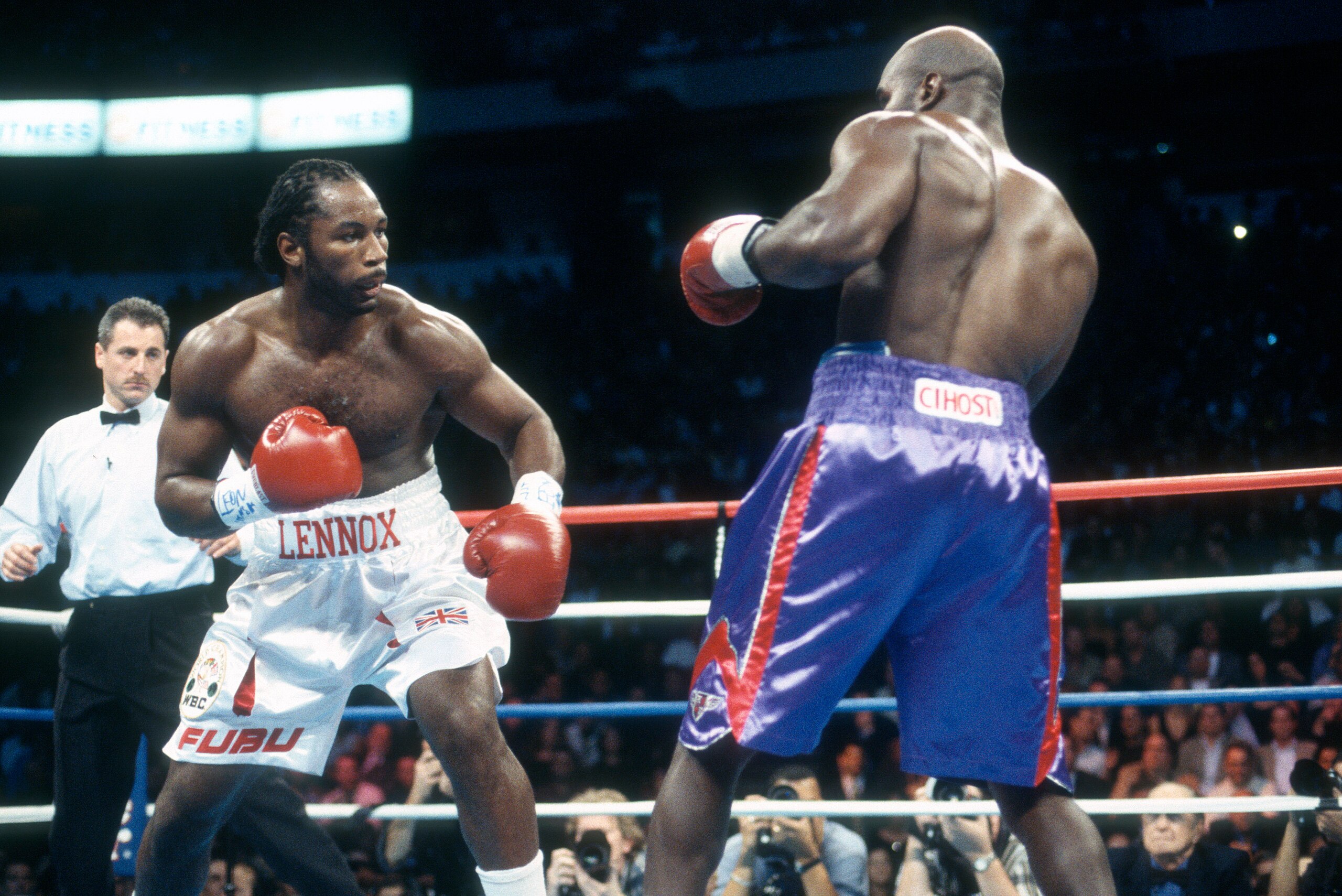 NEW YORK - MARCH 13:  Lennox Lewis and Evander Holyfield fight for the WBC, WBA, IBF and Lineal heavyweight titles on March 13, 1999 at Madison Square Garden in the Manhattan borough of New York City. The fight ended in a draw and Lewis retained the WBC a