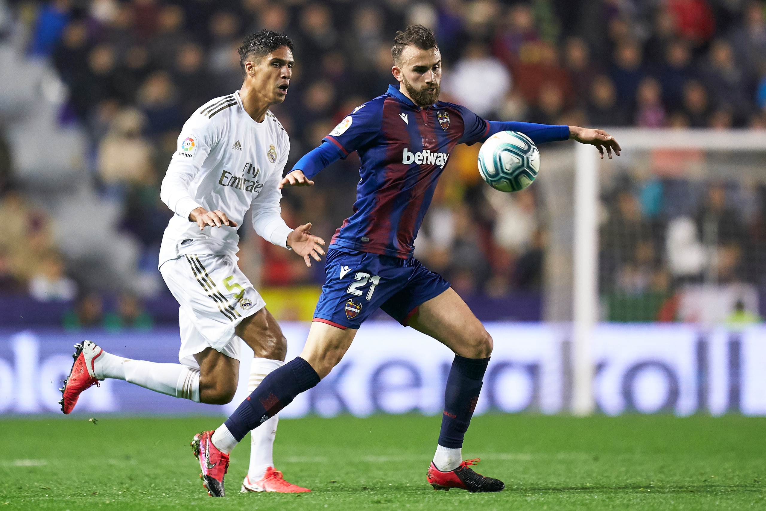 VALENCIA, SPAIN - FEBRUARY 22: Borja Mayoral of Levante UD competes for the ball with Raphael Varane of Real Madrid during the La Liga match between Levante UD and Real Madrid CF at Ciutat de Valencia on February 22, 2020 in Valencia, Spain. (Photo by Mat