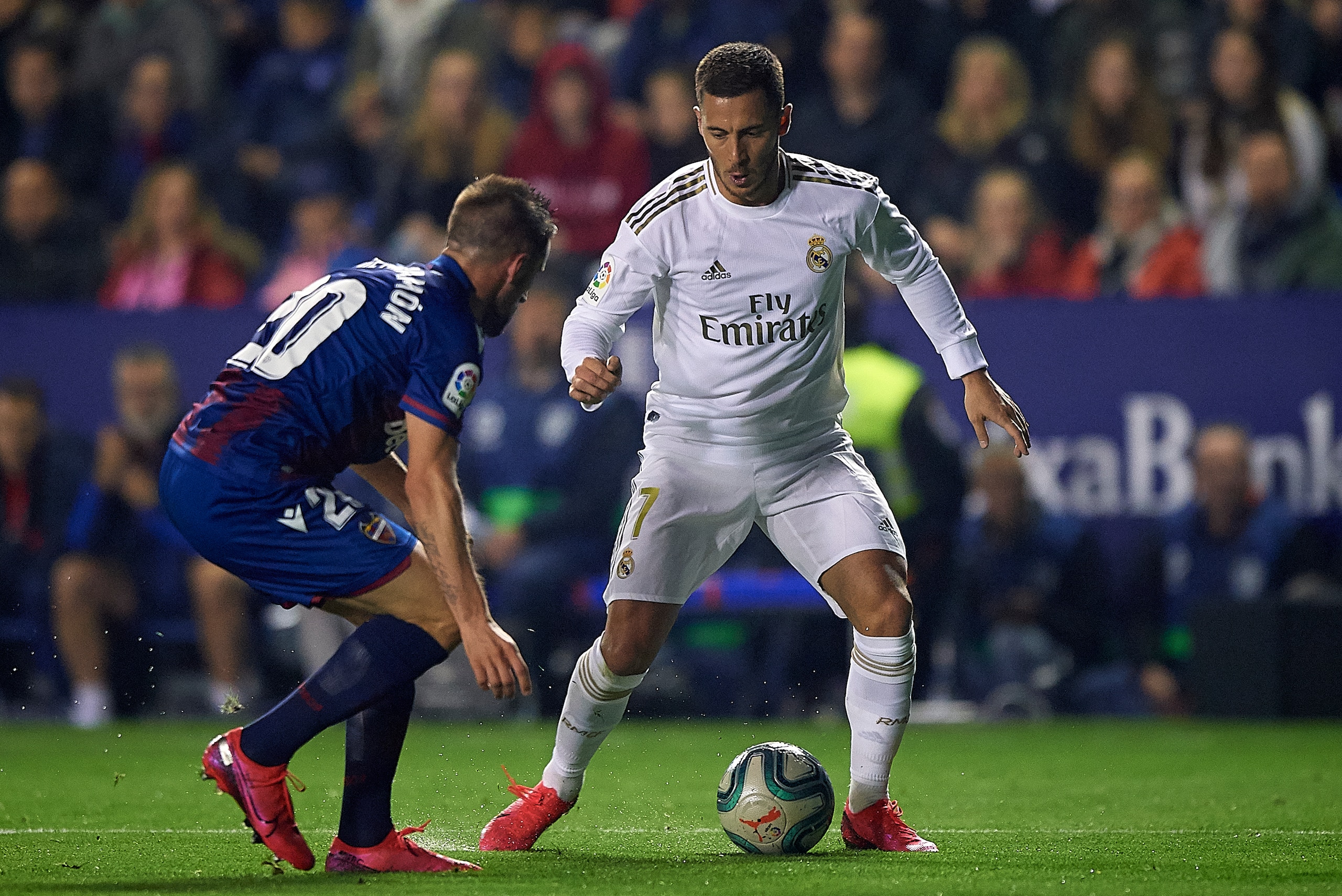 VALENCIA, SPAIN - FEBRUARY 22: Jorge Miramon (L) of Levante competes for the ball with Eden Hazard of Real Madrid during the Liga match between Levante UD and Real Madrid CF at Ciutat de Valencia on February 22, 2020 in Valencia, Spain. (Photo by Pablo Mo