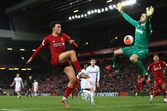 LIVERPOOL, ENGLAND - FEBRUARY 24: Trent Alexander-Arnold of Liverpool passes the ball past Åukasz FabiaÅski of West Ham United for Sadio Mané of Liverpool to scores his sides third goal during the Premier League match between Liverpool FC and West Ham Uni