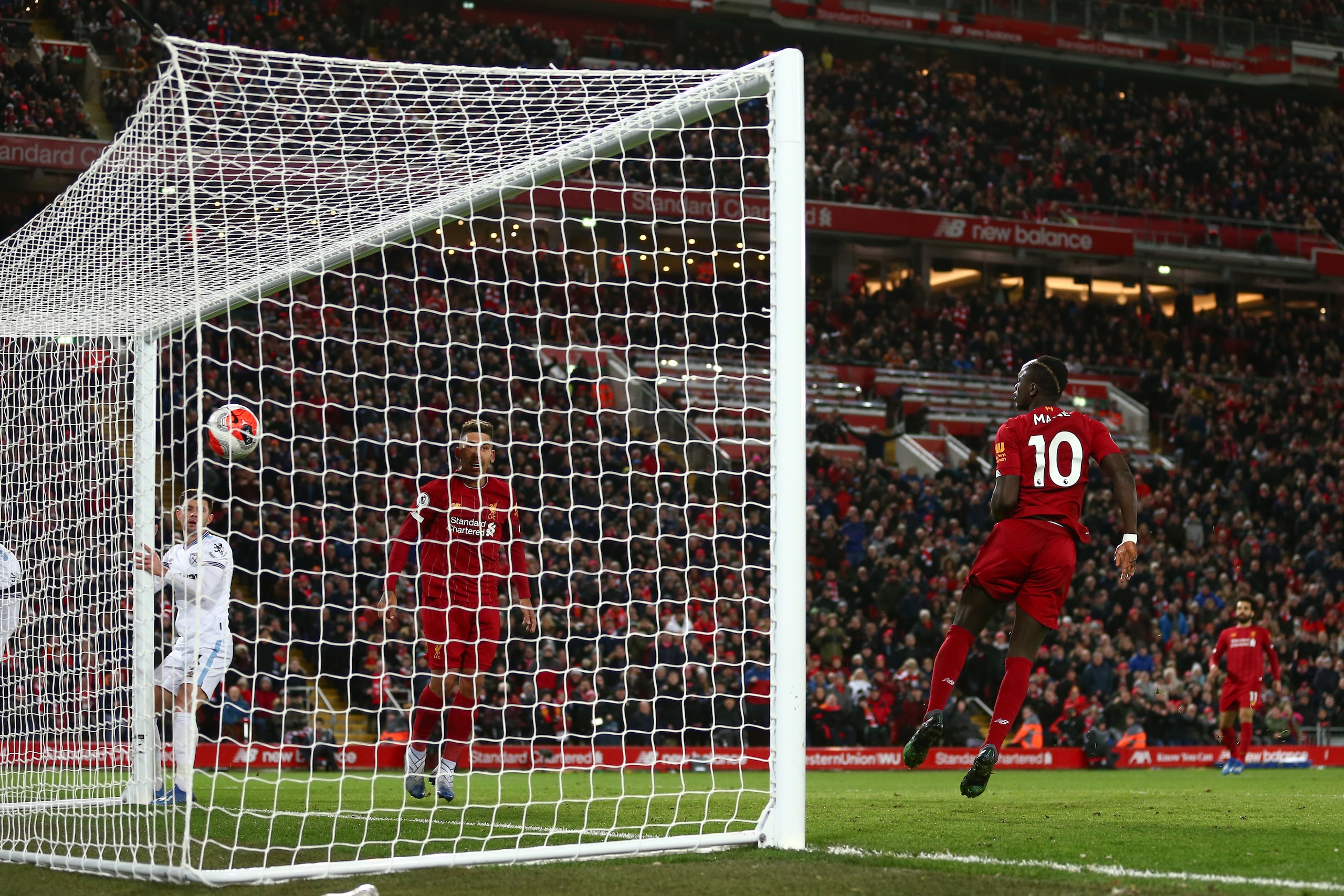 LIVERPOOL, ENGLAND - FEBRUARY 24: Sadio Mane of Liverpool scores a goal to make it 3-2 during the Premier League match between Liverpool FC and West Ham United at Anfield on February 24, 2020 in Liverpool, United Kingdom. (Photo by Robbie Jay Barratt - AM