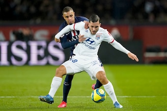 PARIS, FRANCE - FEBRUARY 9: (L-R) Layvin Kurzawa of Paris Saint Germain, Rayan Cherki of Olympique Lyon  during the French League 1  match between Paris Saint Germain v Olympique Lyon at the Parc des Princes on February 9, 2020 in Paris France (Photo by G