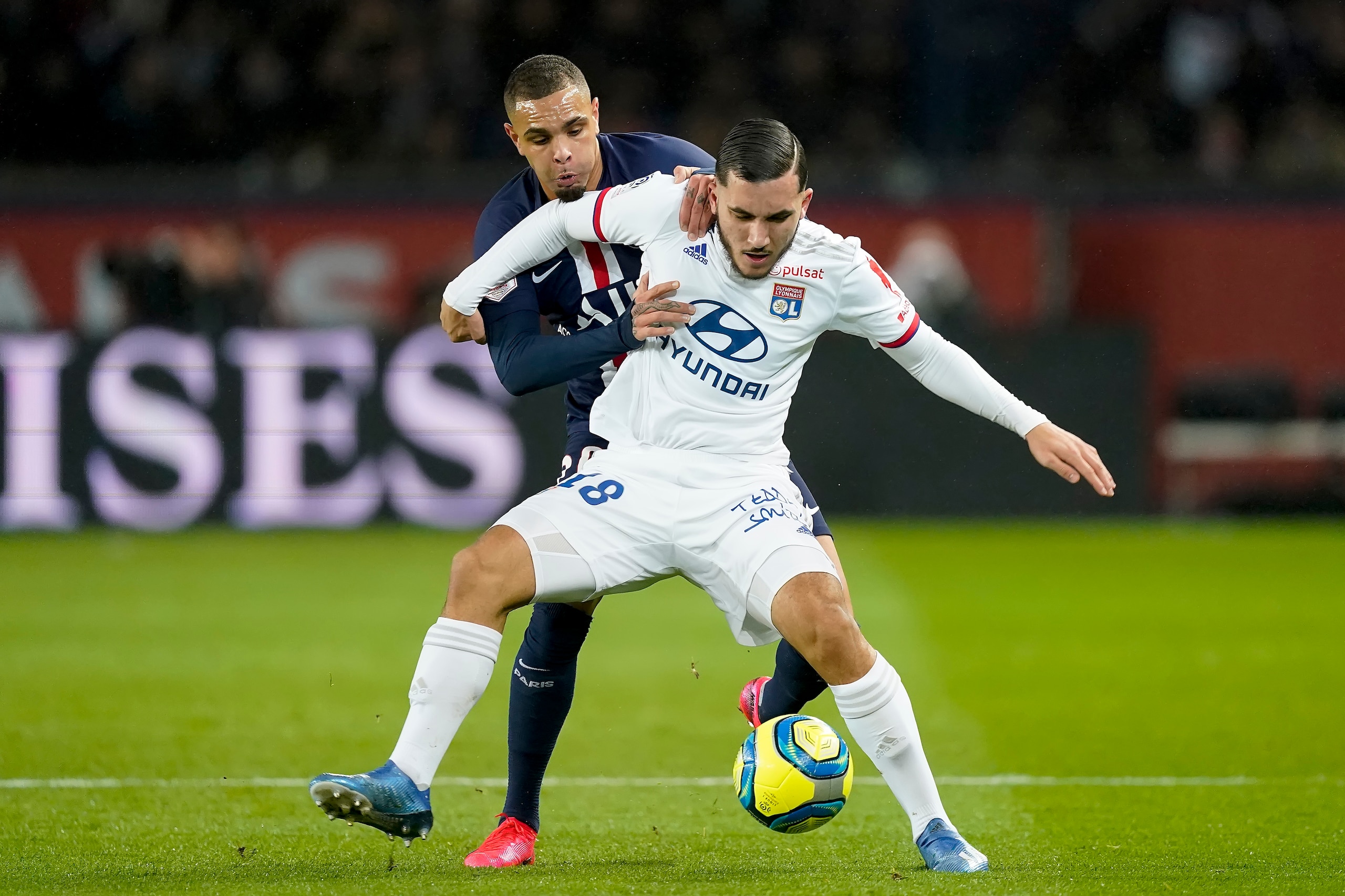 PARIS, FRANCE - FEBRUARY 9: (L-R) Layvin Kurzawa of Paris Saint Germain, Rayan Cherki of Olympique Lyon  during the French League 1  match between Paris Saint Germain v Olympique Lyon at the Parc des Princes on February 9, 2020 in Paris France (Photo by G