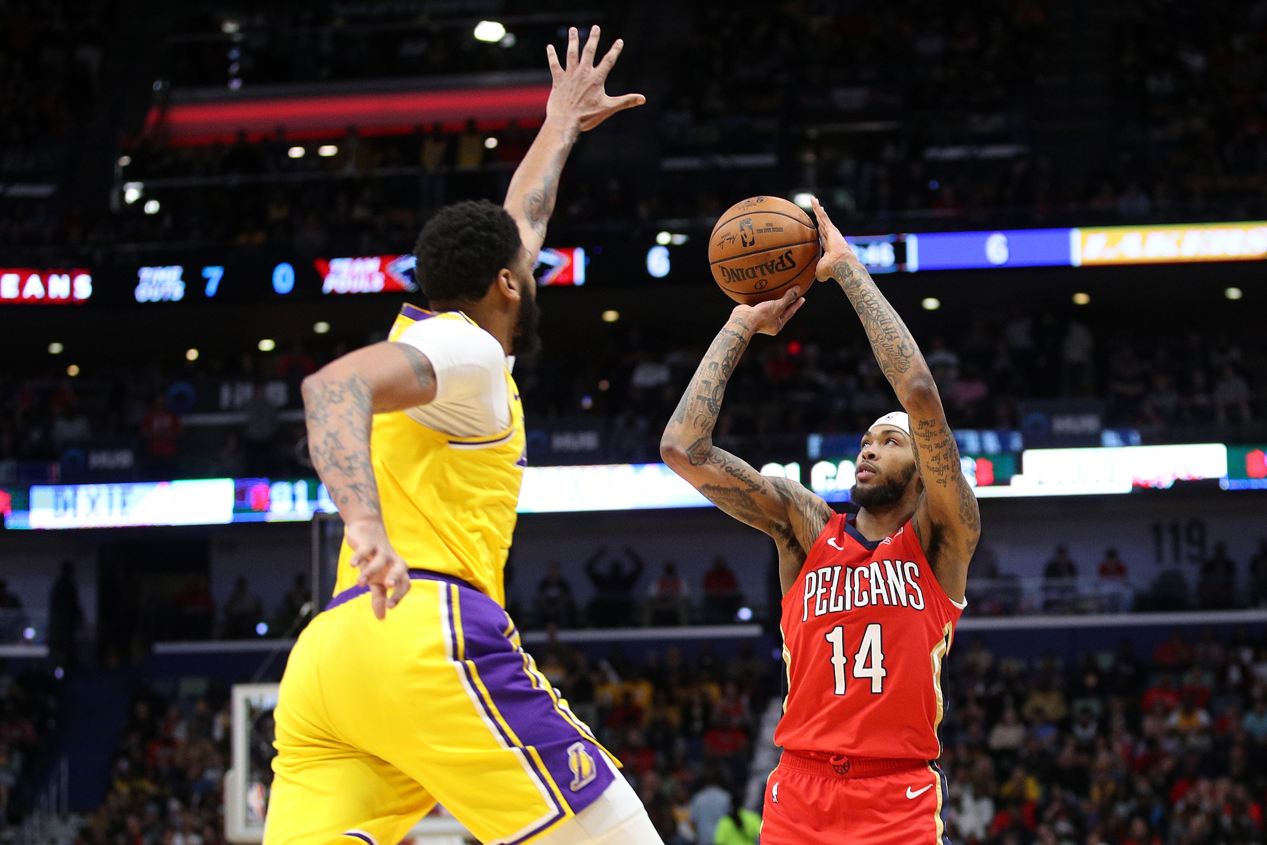 NEW ORLEANS, LOUISIANA - NOVEMBER 27: Brandon Ingram #14 of the New Orleans Pelicans shoots the ball over Anthony Davis #3 of the Los Angeles Lakers at Smoothie King Center on November 27, 2019 in New Orleans, Louisiana.  NOTE TO USER: User expressly ackn