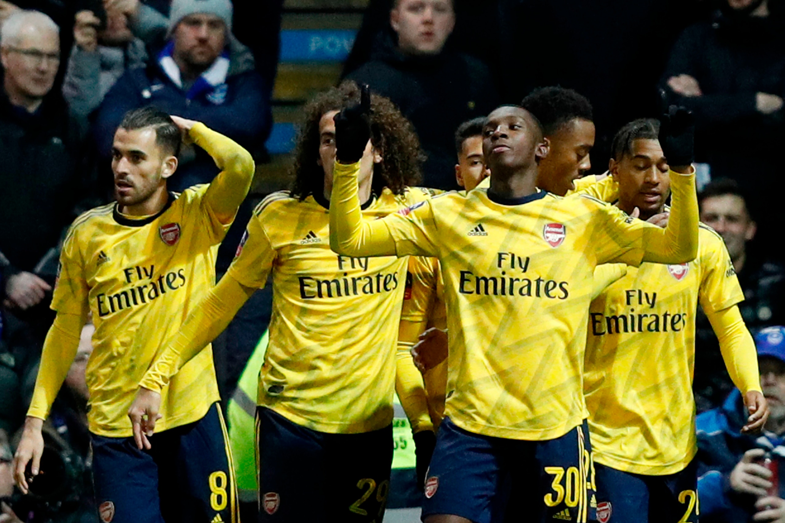 Arsenal's English striker Eddie Nketiah (2R) celebrates scoring their second goal during the English FA Cup fifth round football match between Portsmouth and Arsenal at Fratton Park stadium in Portsmouth, southern England, on March 2, 2020. (Photo by Adri