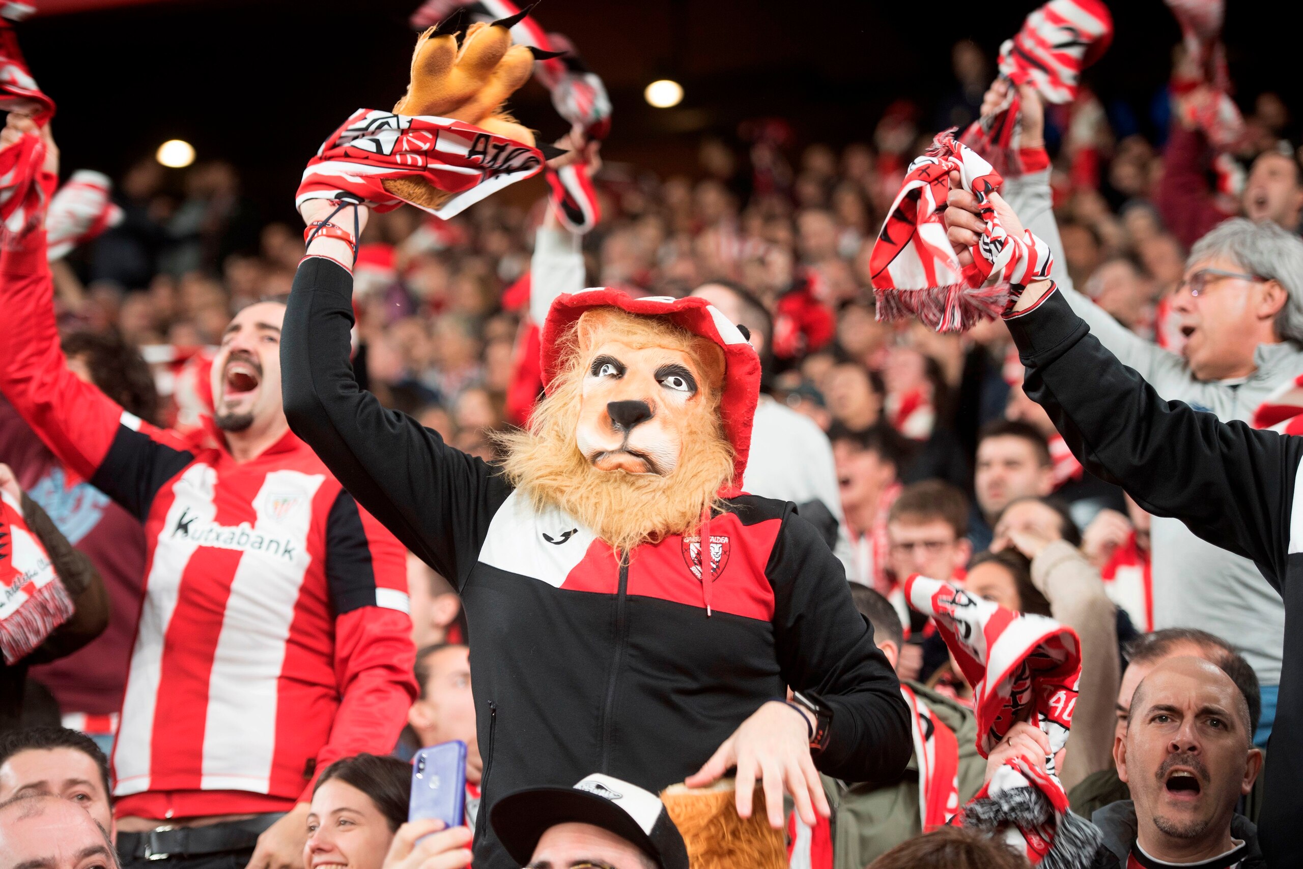 Athletic Bilbao supporters cheer their team during a footall match at San Mames stadium in the Spanish Basque city of Bilbao, on February 12, 2020. - The all-seater football stadium of San Mames in Bilbao, also known as