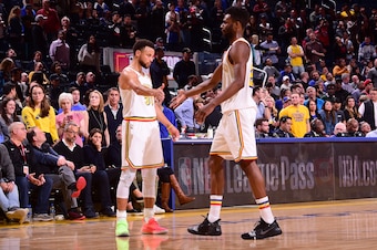 SAN FRANCISCO, CA - MARCH 5: Stephen Curry #30 of the Golden State Warriors high-fives Andrew Wiggins #22 of the Golden State Warriors on March 5, 2020 at Chase Center in San Francisco, California. NOTE TO USER: User expressly acknowledges and agrees that
