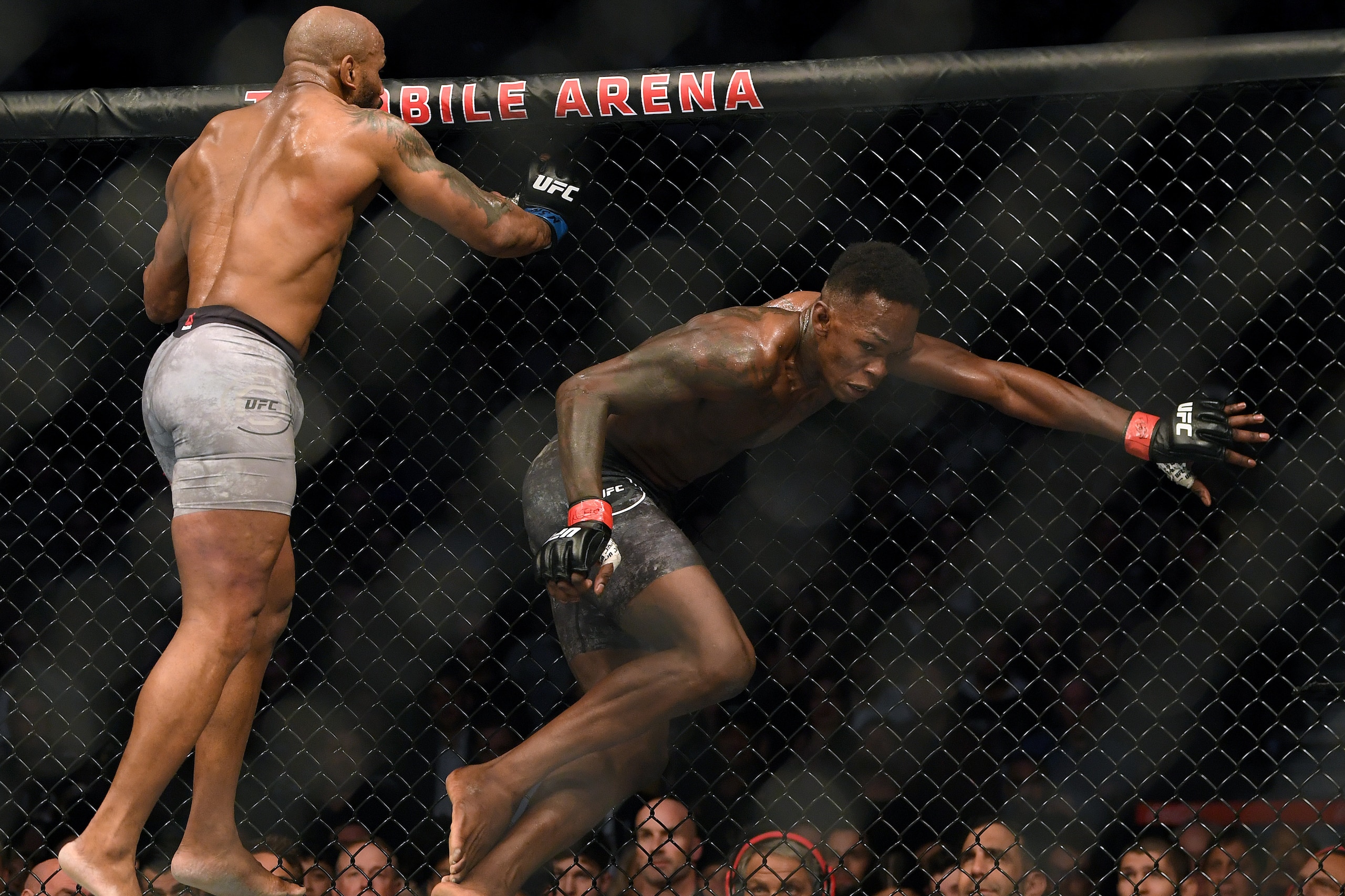 LAS VEGAS, NEVADA - MARCH 07: Israel Adesanya avoids Yoel Romero, in a Adesanya decision win to retain the middleweight title at T-Mobile Arena on March 07, 2020 in Las Vegas, Nevada. (Photo by Harry How/Getty Images) LAS VEGAS, NEVADA - MARCH 07: Israel Adesanya avoids Yoel Romero, in a Adesanya decision win to retain the middleweight title at T-Mobile Arena on March 07, 2020 in Las Vegas, Nevada. (Photo by Harry How/Getty Images)